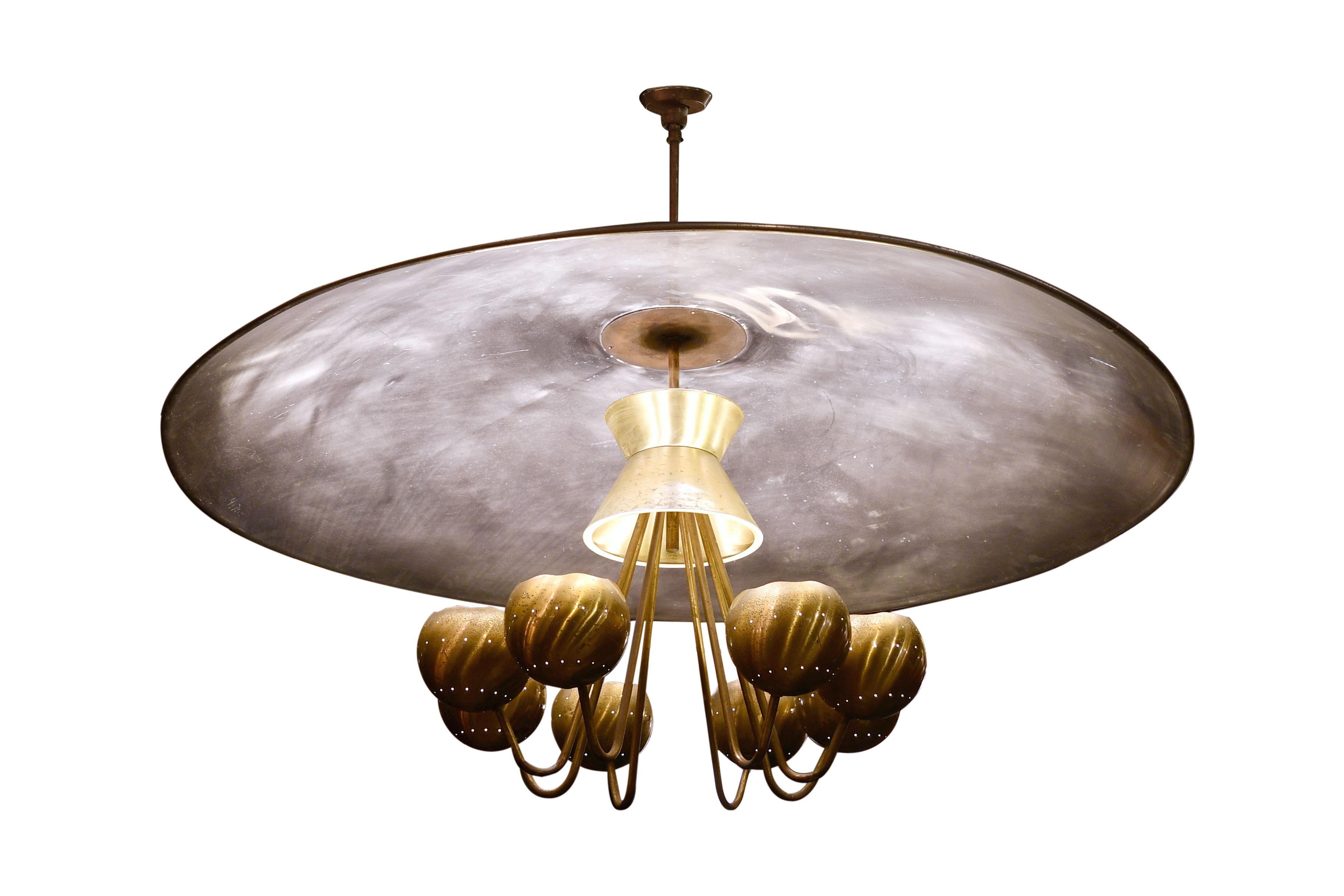 This light truly reflects the creativity that goes into lighting design! Although the main body is just thirty inch wide in diameter, this chandelier features an impressive five foot wide reflective bowl that throws light around to cast a warm glow.