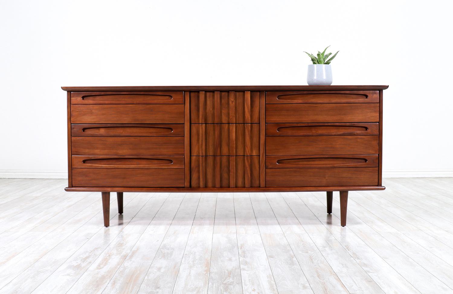 Mid-Century Modern 9-drawer dresser by American of Martinsville.

________________________________________

Transforming a piece of Mid-Century Modern furniture is like bringing history back to life, and we take this journey with passion and