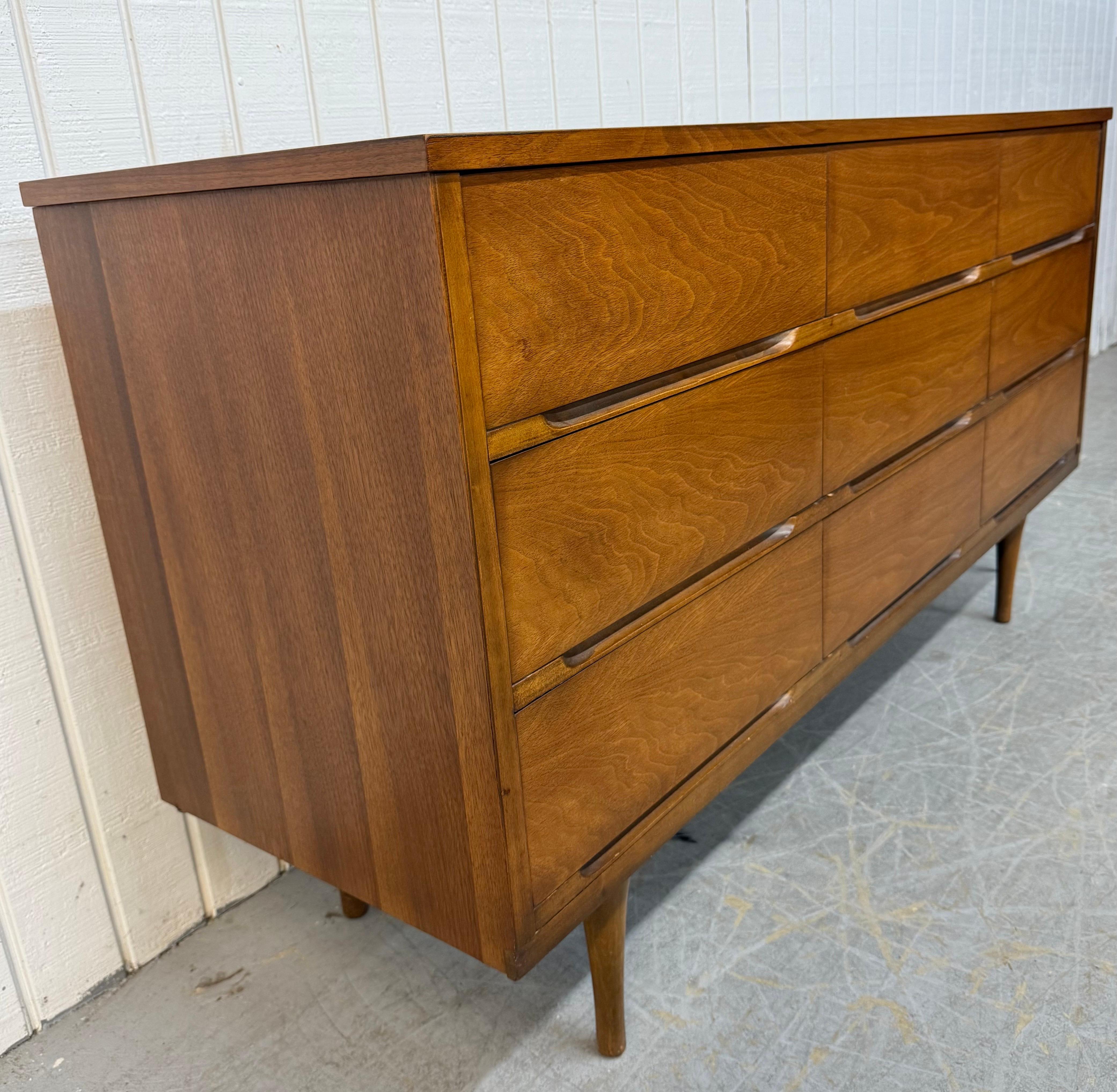 This listing is for a Mid-Century Modern 9-Drawer Walnut Dresser. Featuring a straight line design, nine  drawers with recessed pulls, modern legs, and a beautiful walnut finish. This is an exceptional combination of quality and MCM design! 