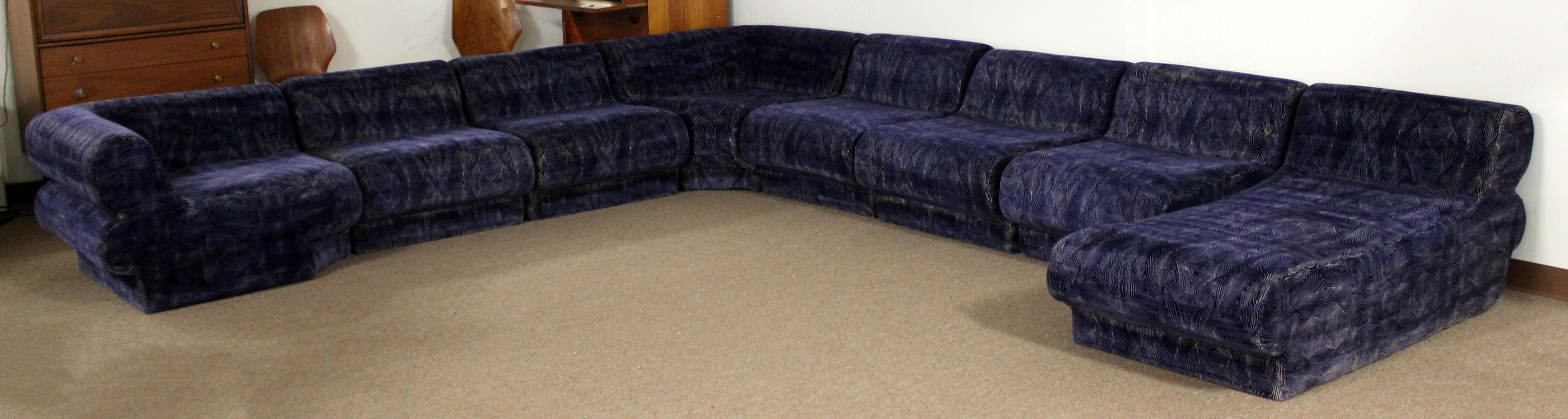 For your consideration is an incredible, nine piece sectional modular sofa, blue velvet with white accents upholstery, by Preview. In very good condition. The dimensions of the two corner pieces are 38