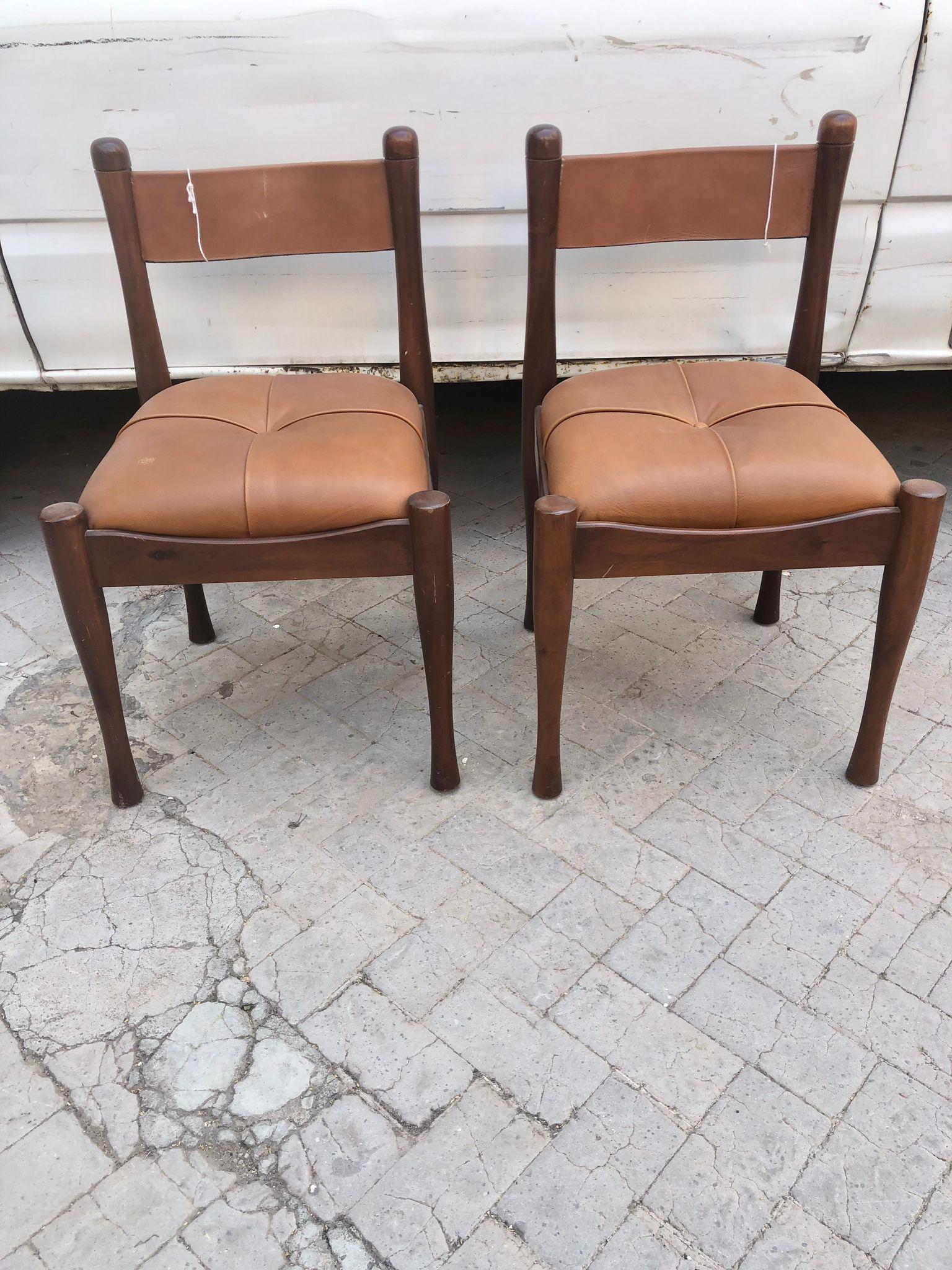 Amazing Pair of Italian Mid Century Modern Silvio Coppola chairs for Bernini.
This set of two chairs was designed by Silvio Coppola for Bernini, and produced in the 1960 in Italy. The chairs frame are made of beech wood with foam padding and