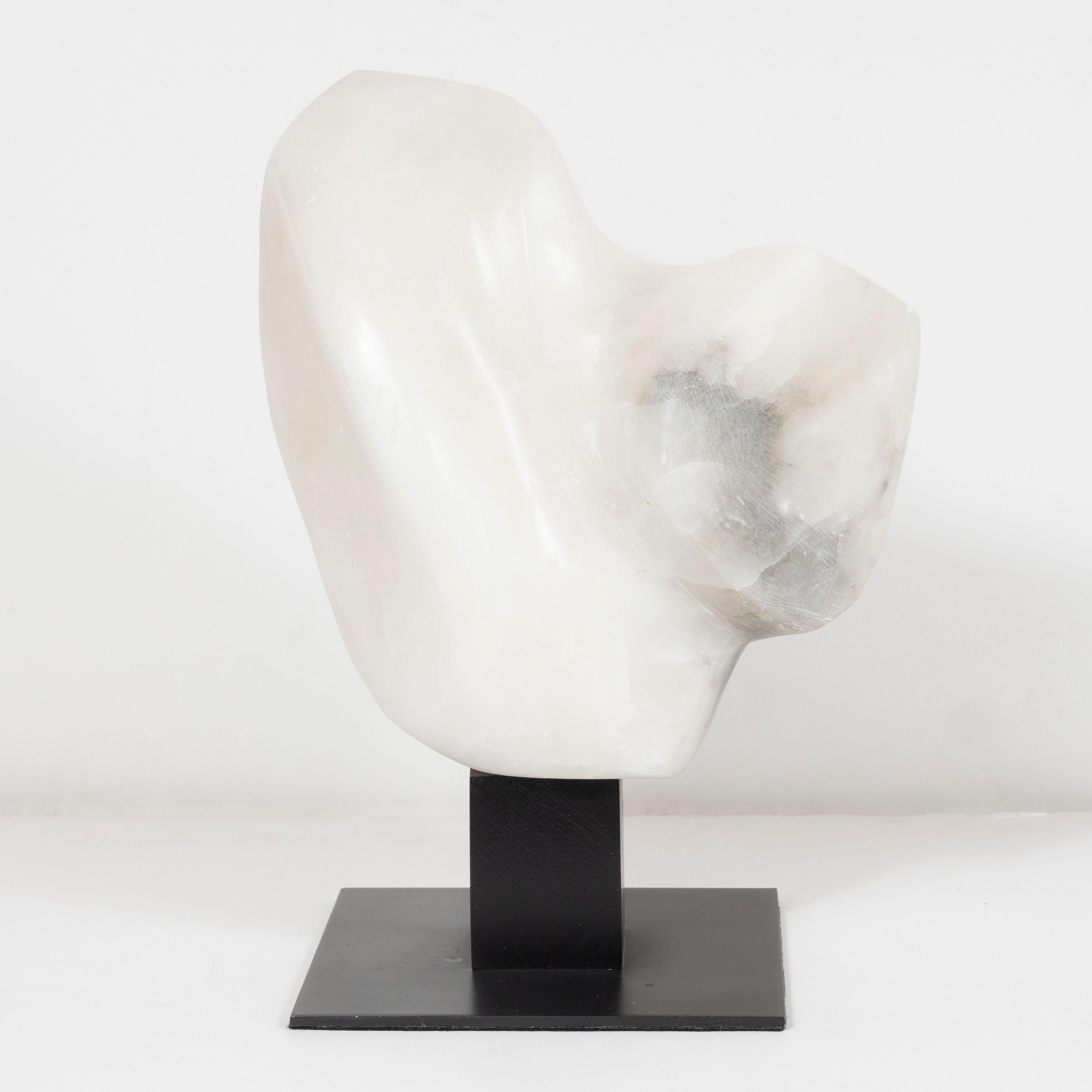 This refined marble sculpture was realized in the United States circa 1960. It features an amorphic organic form carved from a single piece of White marble. With its unblemished surface and clean modernist lines, this piece would be a winning