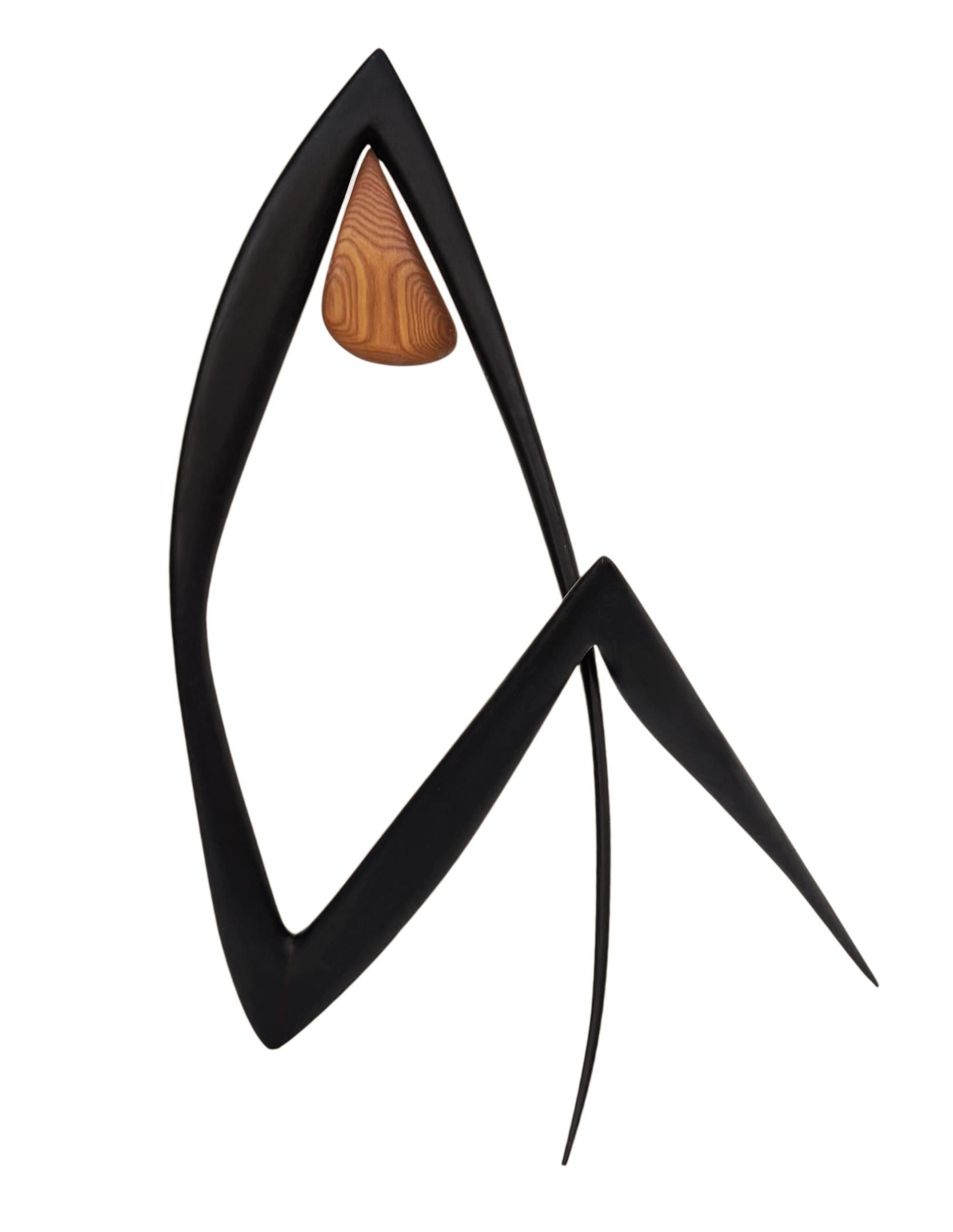A funky solid wood sculpture circa 1970's. It features solid ebonized & natural oak. 