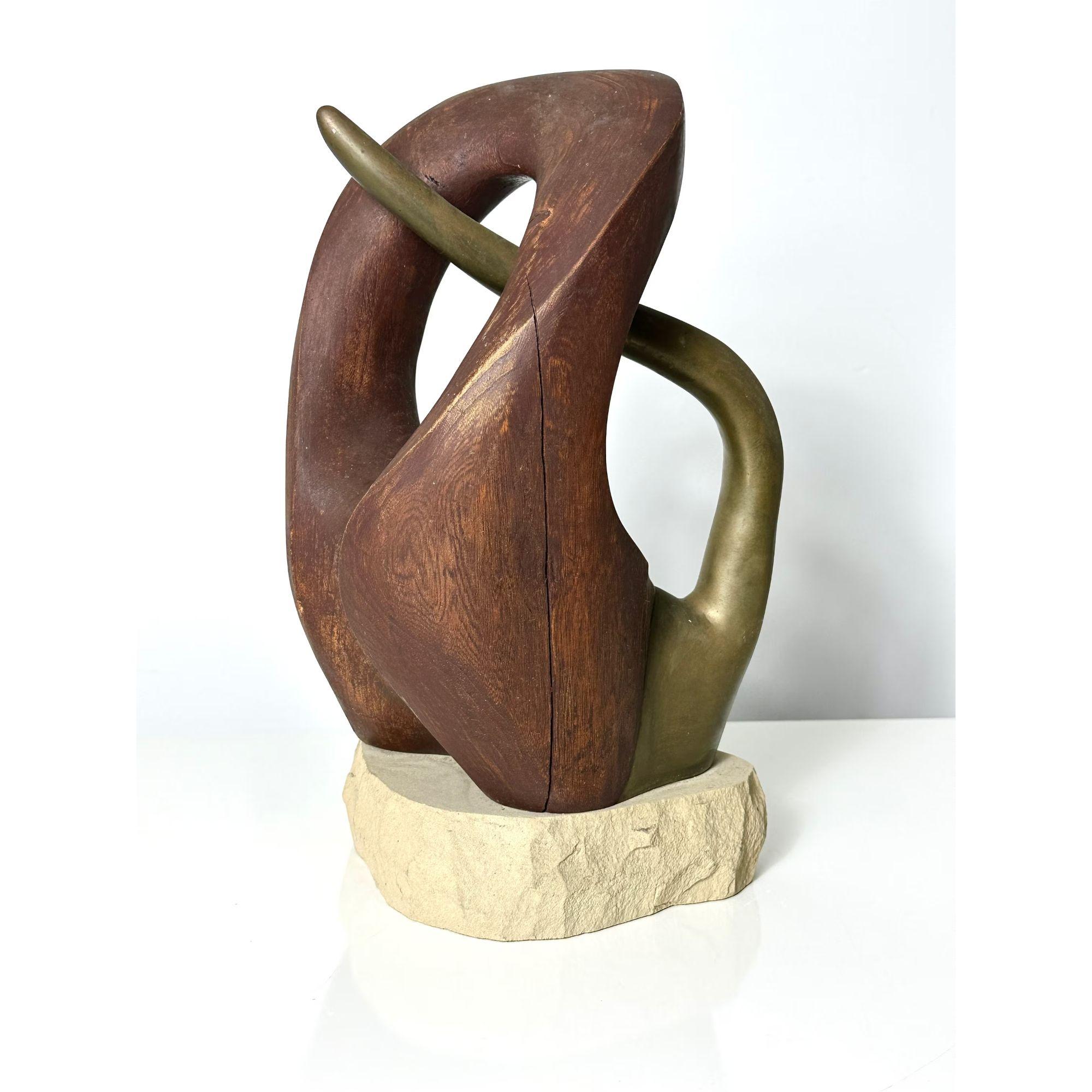 Orignal Vintage Mid Century Modern Abstract Biomorphic Wood & Bronze Sculpture by Fred Scott 

Very unique sculpture by Ohio artist Fred Scott circa 1960s
Carved wood with intersecting bronze on a chiseled stone base
Acquired from the estate of the