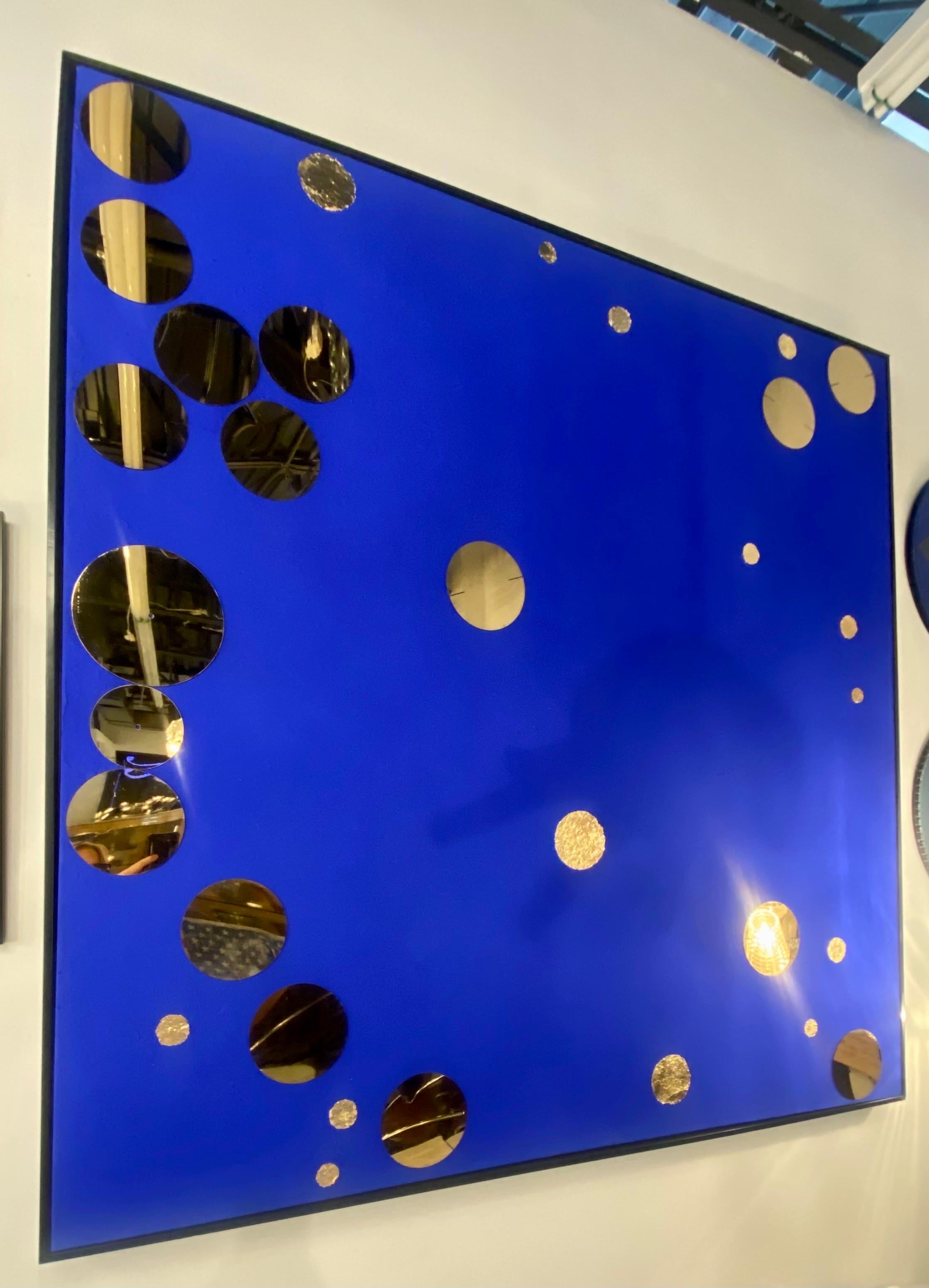French Bubbles! A circular energy abstract painting in a Klein blue with gold leaf and gold metal bubbles. The painting is large and has an uplifting presence. 