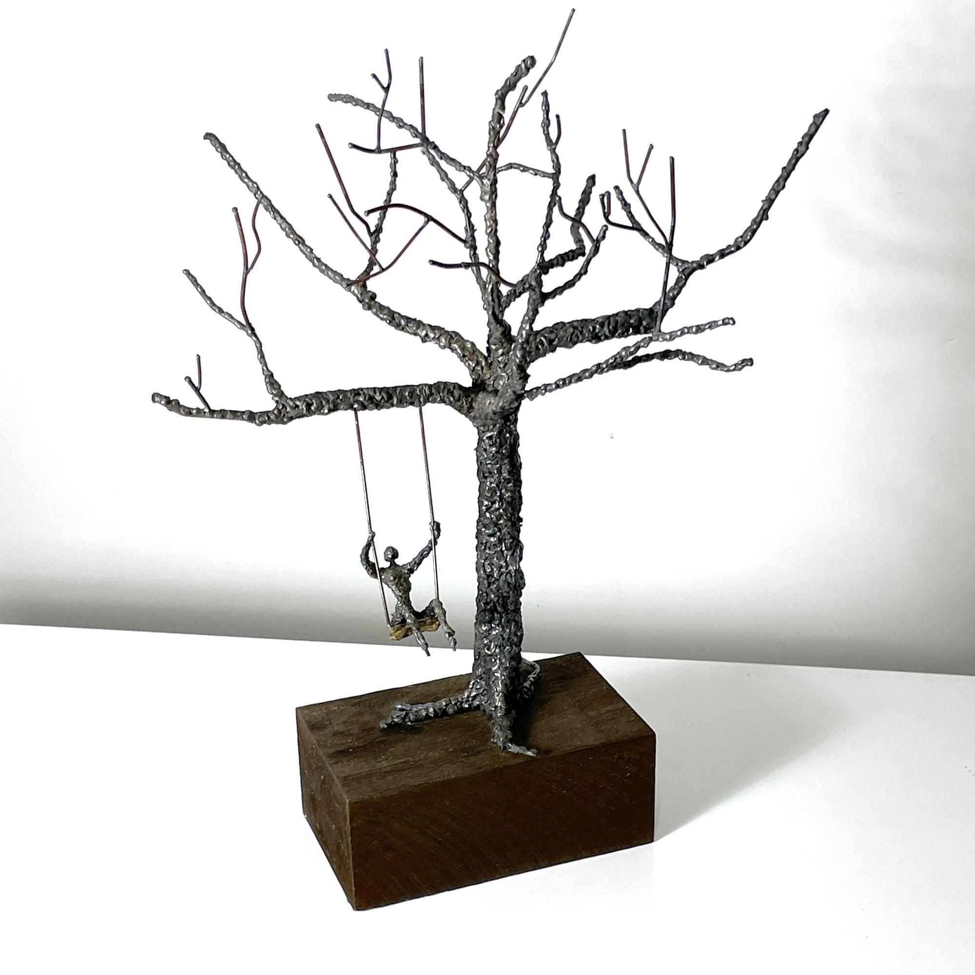Fantastic large scale brutalist sculpture by anonymous artist circa 1960s
Drip case metal and copper wire tree with figure on a swing

Mounted to wood base / Unsigned

Additional Information:
Materials: Copper, Wood & Metal
Dimensions: 16