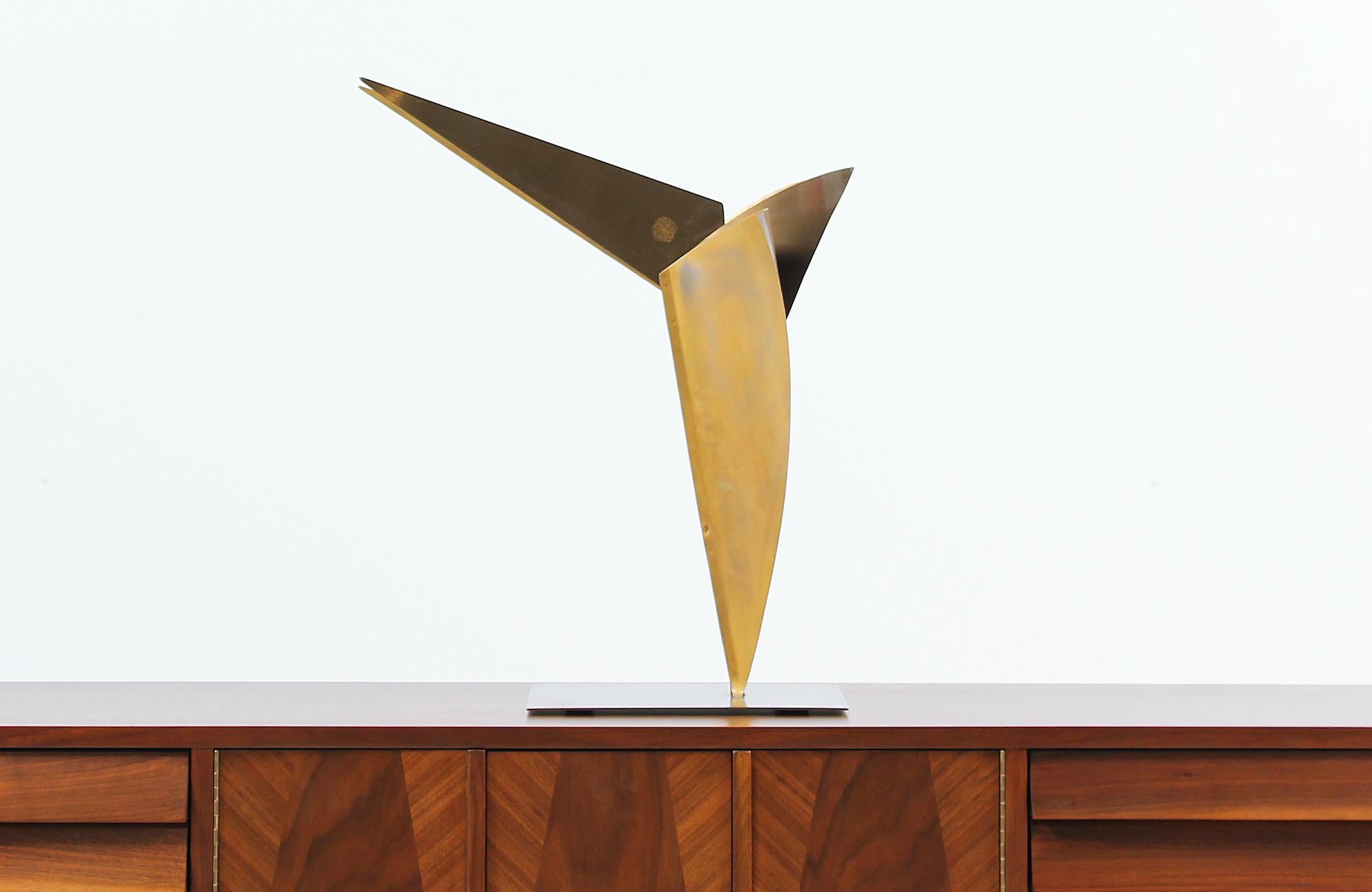 Beautiful cubist sculpture designed and manufactured in the United States circa 1970s. Featuring a quality crafted brass cubist bird with a mix of geometric shapes and textures creating an elegant and bold vibe. This piece is signed by the artist