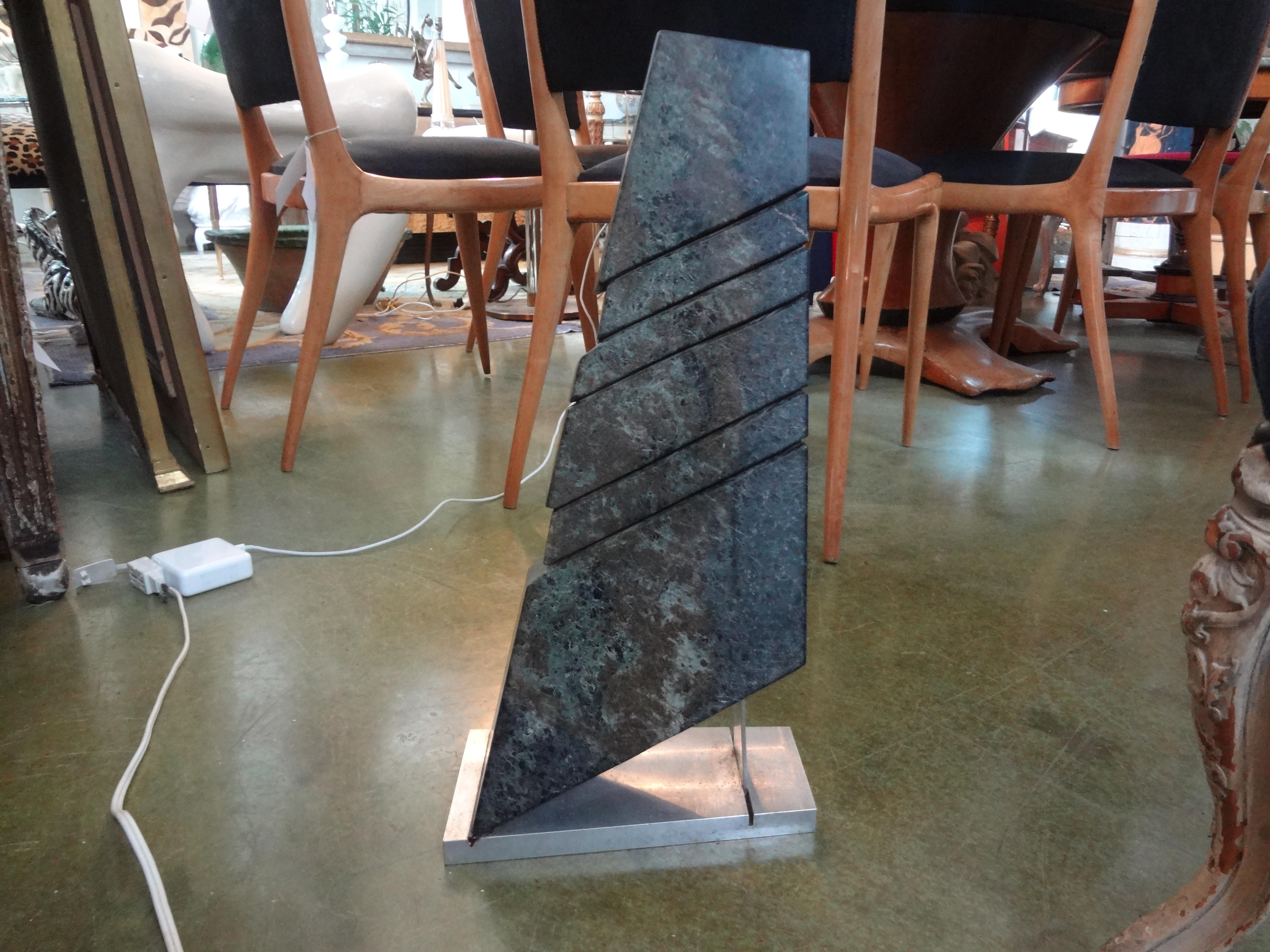 Stunning Mid-Century Modern or Modernist abstract marble sculpture on steel base.
This great geometric marble sculpture is artist signed which is currently under research.
Wood look great on a pedestal or on a console table or cocktail