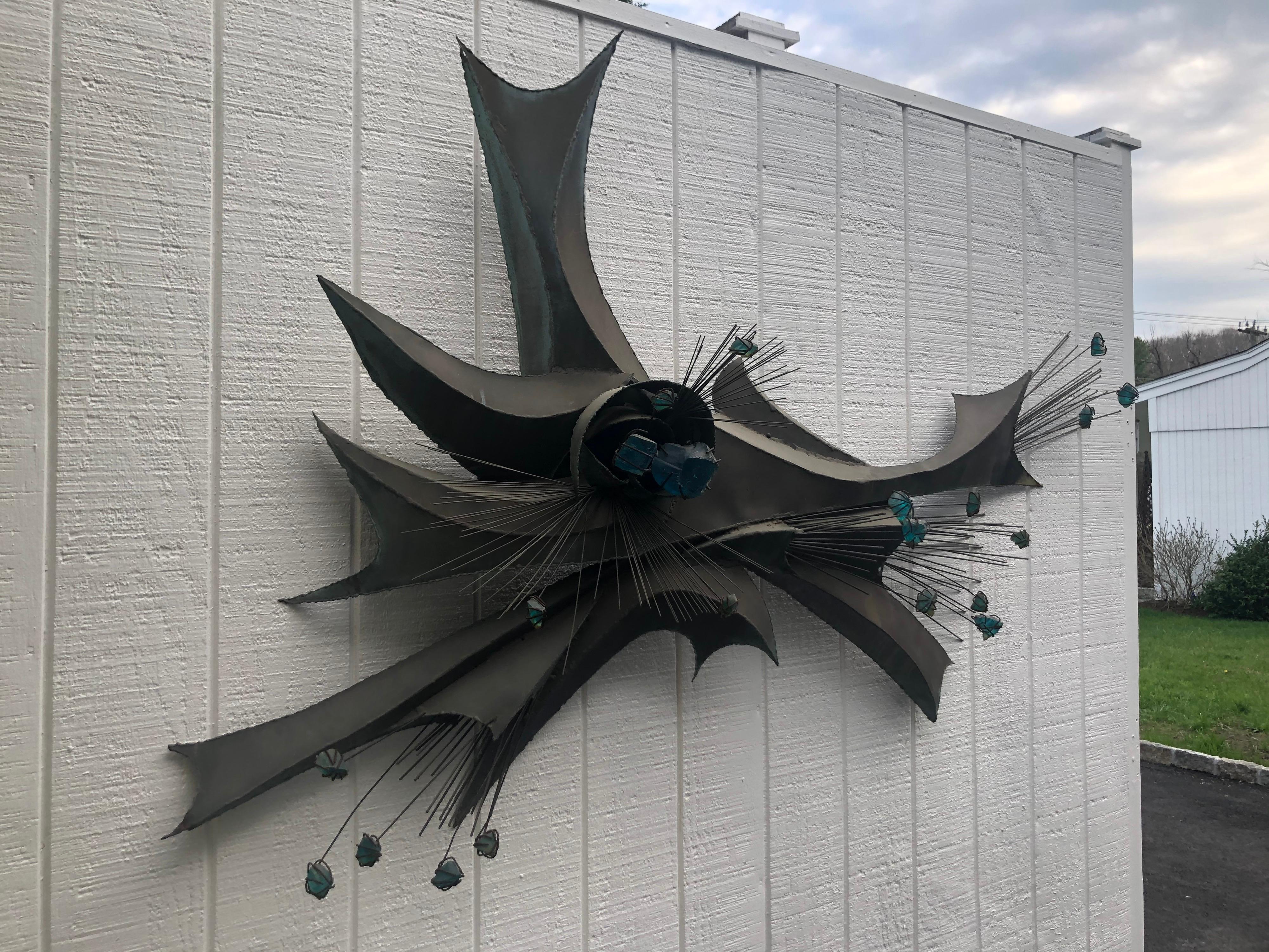 Monumental Mid-Century Modern Abstract Wall sculpture attributed to John Reisetter . Reisetter was one of the known sculptors who worked for The famous Curtis Jere Artisan House run by Jerry Fells and Curtis Freiler. 
This free form atomic custom