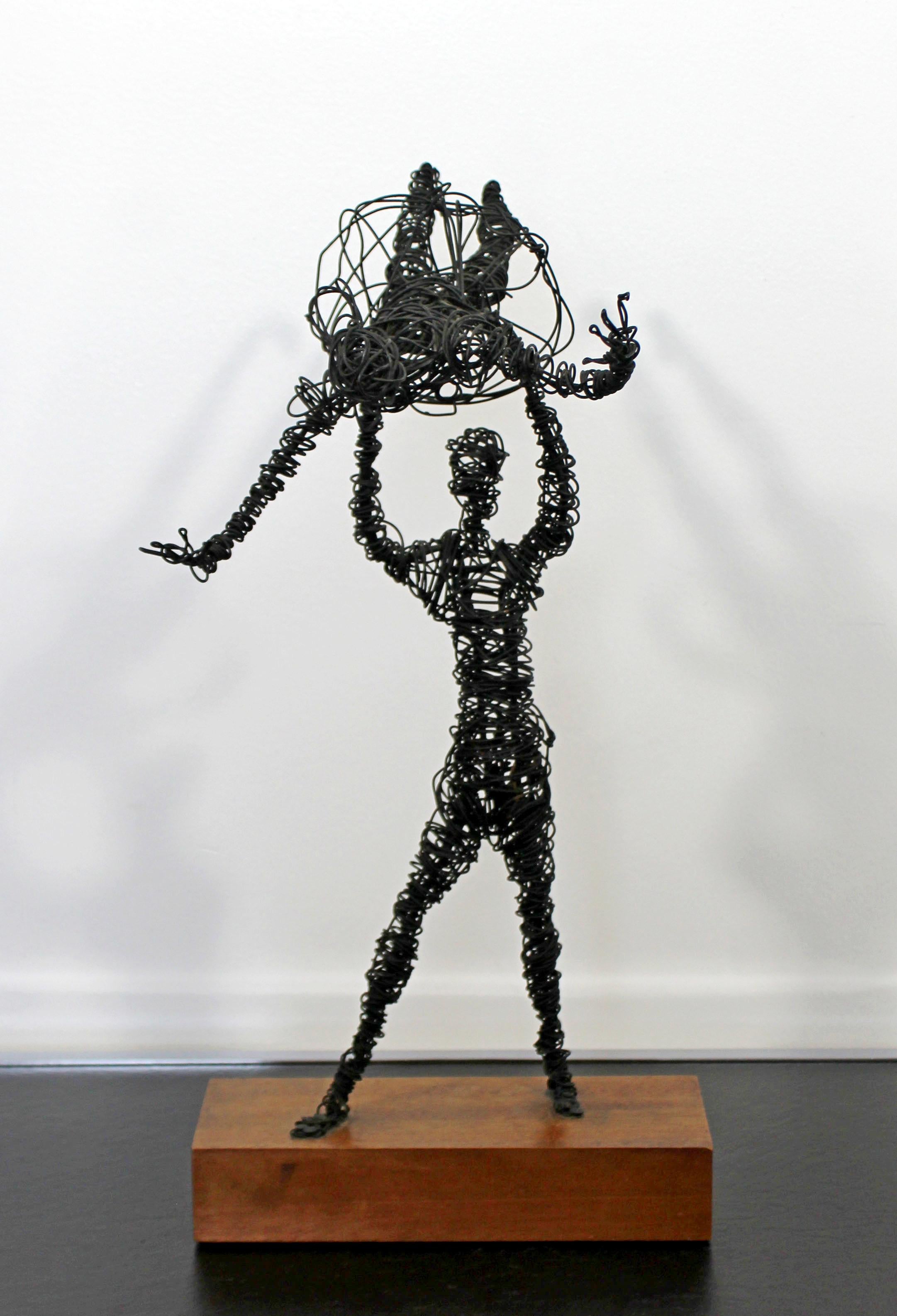 For your consideration is a unique, abstracted, metal wire table sculpture, of a pair of dancers, circa 1960s. In very good vintage condition. The dimensions are 9.5