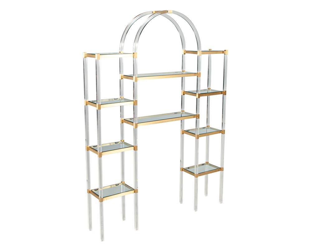 Introducing the Mid-Century Modern Acrylic and Brass Wall Unit Etagere, a stunning piece of furniture designed by renowned designer Charles Hollis Jones, made in the USA circa 1970’s. This wall unit etagere is a perfect addition to any modern or