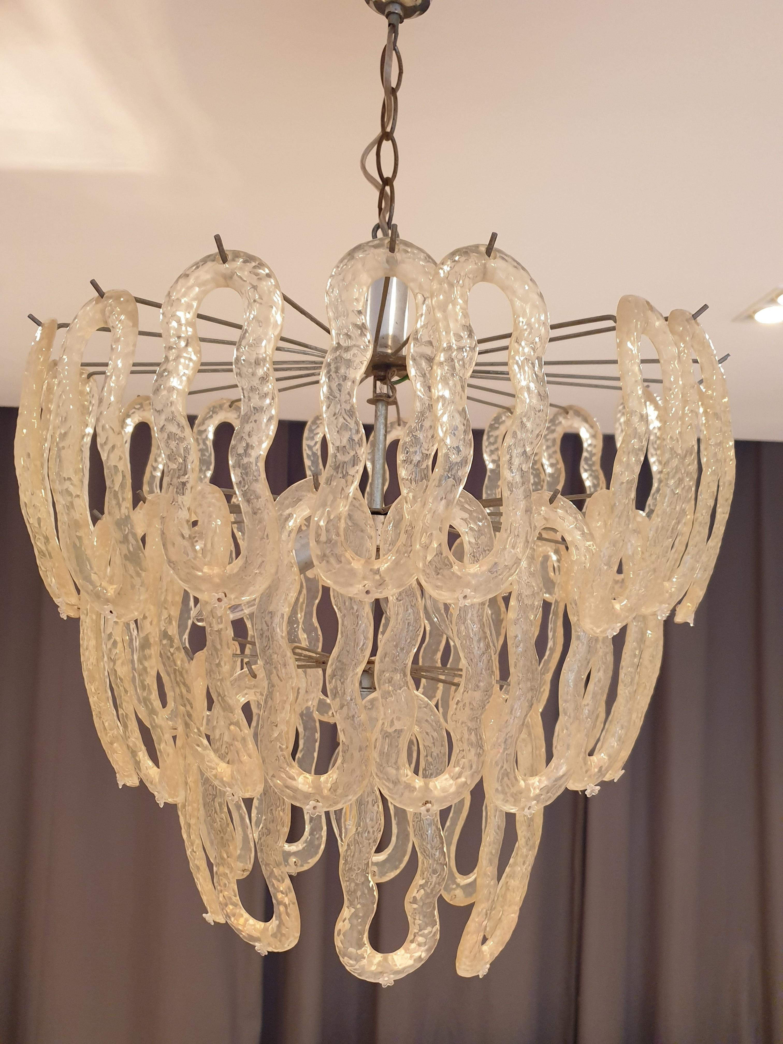 Well sized Mid-Century Modern chrome and acrylic chandelier with 7 lamp holders. The acrylic leaves are surrmounted by a small decorative acrylic flower on the ends.