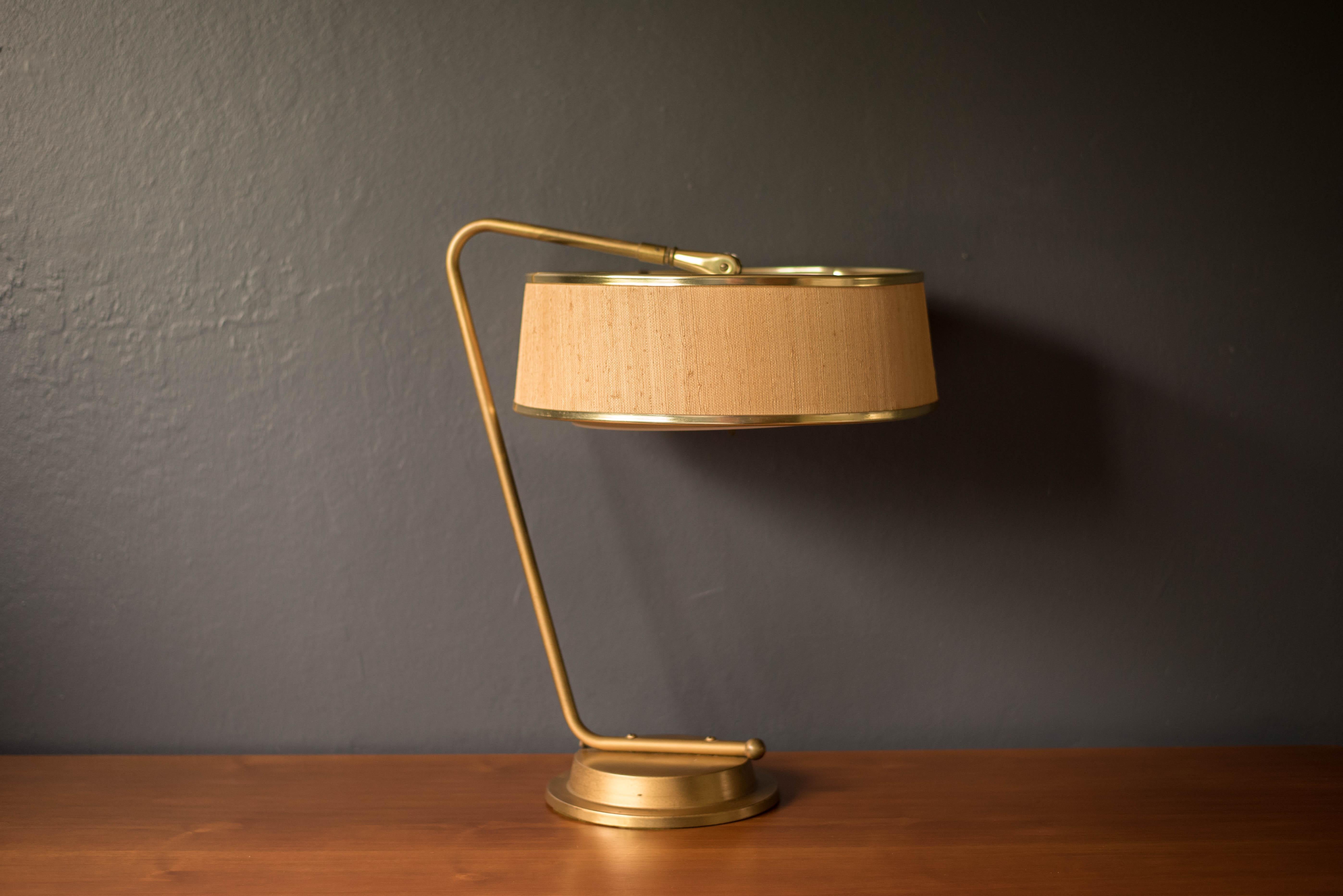 Vintage task table office lamp designed by Gerald Thurston for Lightolier, circa 1960s. This unique piece includes the original grasscloth drum shade and perforated metal diffuser adjustable top. Complete with a weighted base finished in brass that