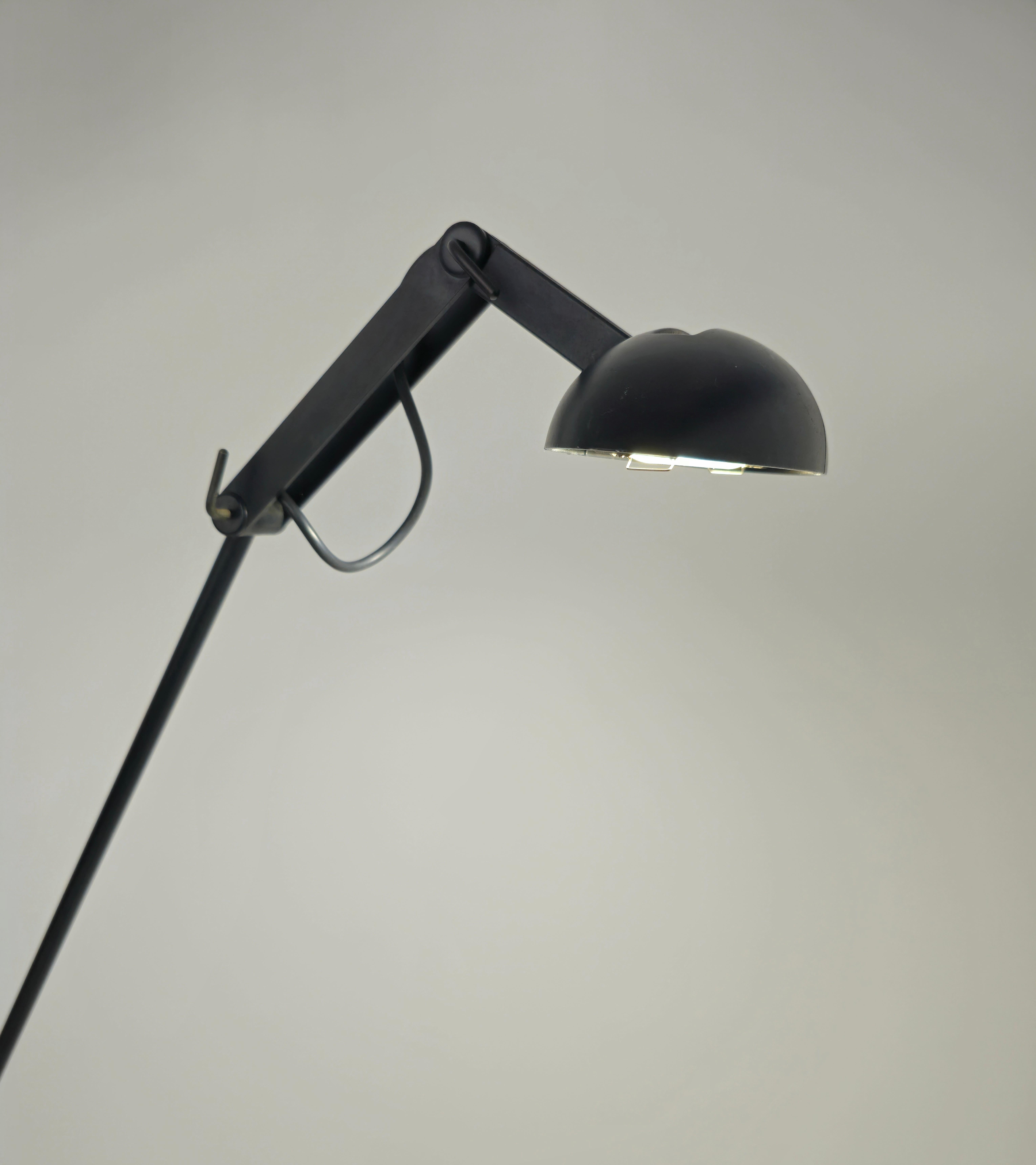 Rare black enamelled brass floor lamp with halogen light. Directional with three moving parts. It really has an excellent mechanism to project the light as you like. Refined design. Italian production from the 80s/90s. Please watch the video and