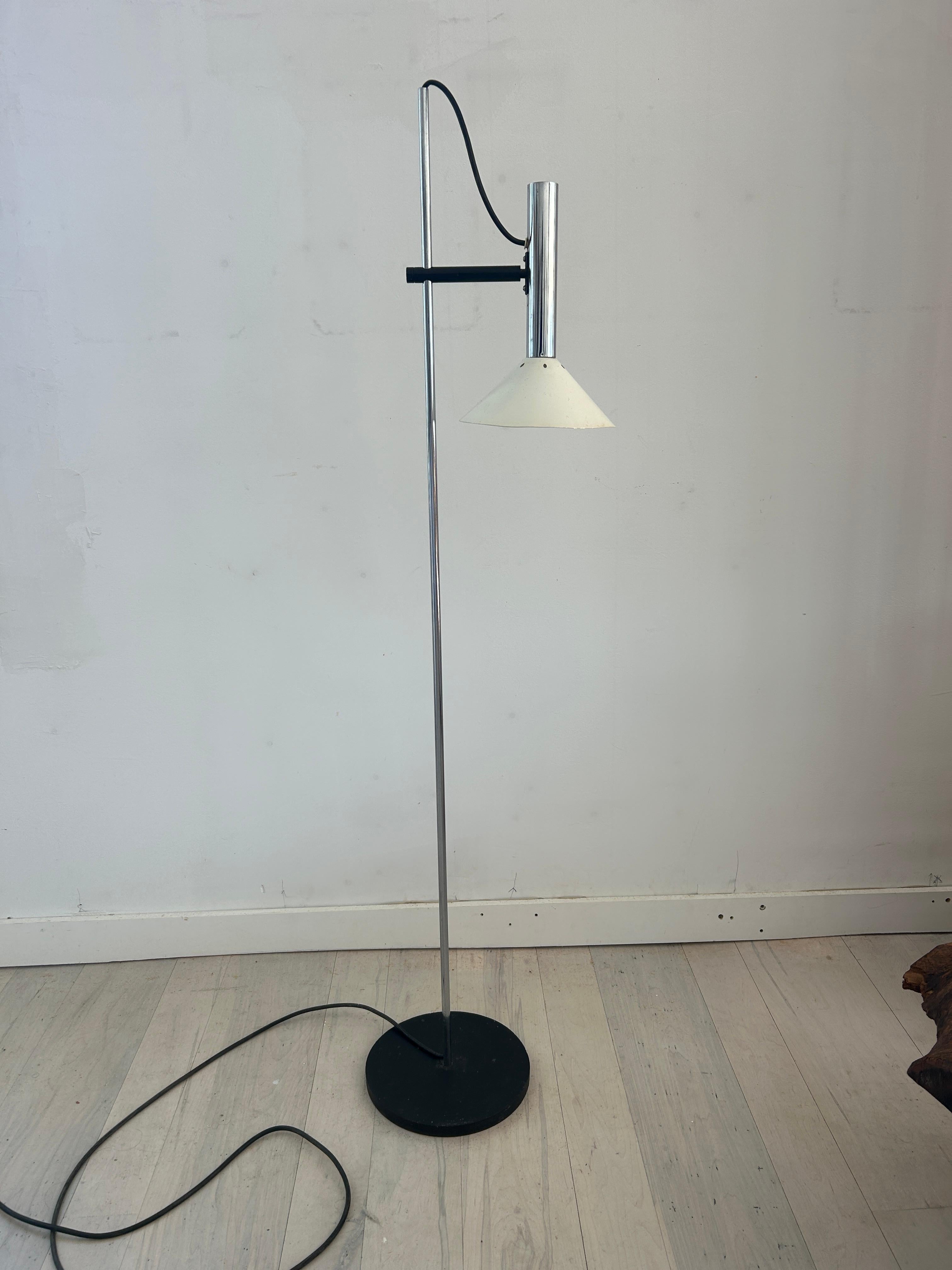 Mid-Century Modern adjustable height chrome floor lamp style of Joe Colombo. No dings to shade and minimal wear to the chrome. Overall very good example and ready for use. Working condition. Appears to be in all original vintage condition. Located