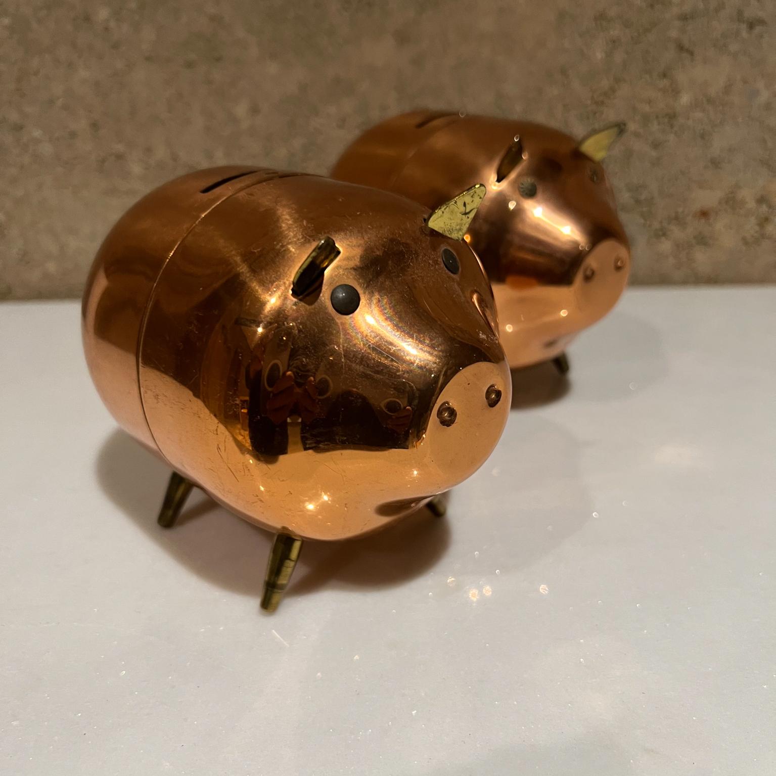 Mid-Century Modern adorable piggy bank in Copper
 4 tall x 3.5 width x 5.25 depth
Preowned original vintage condition.
The bank opens at the middle.
Two are available.
See images provided.
  