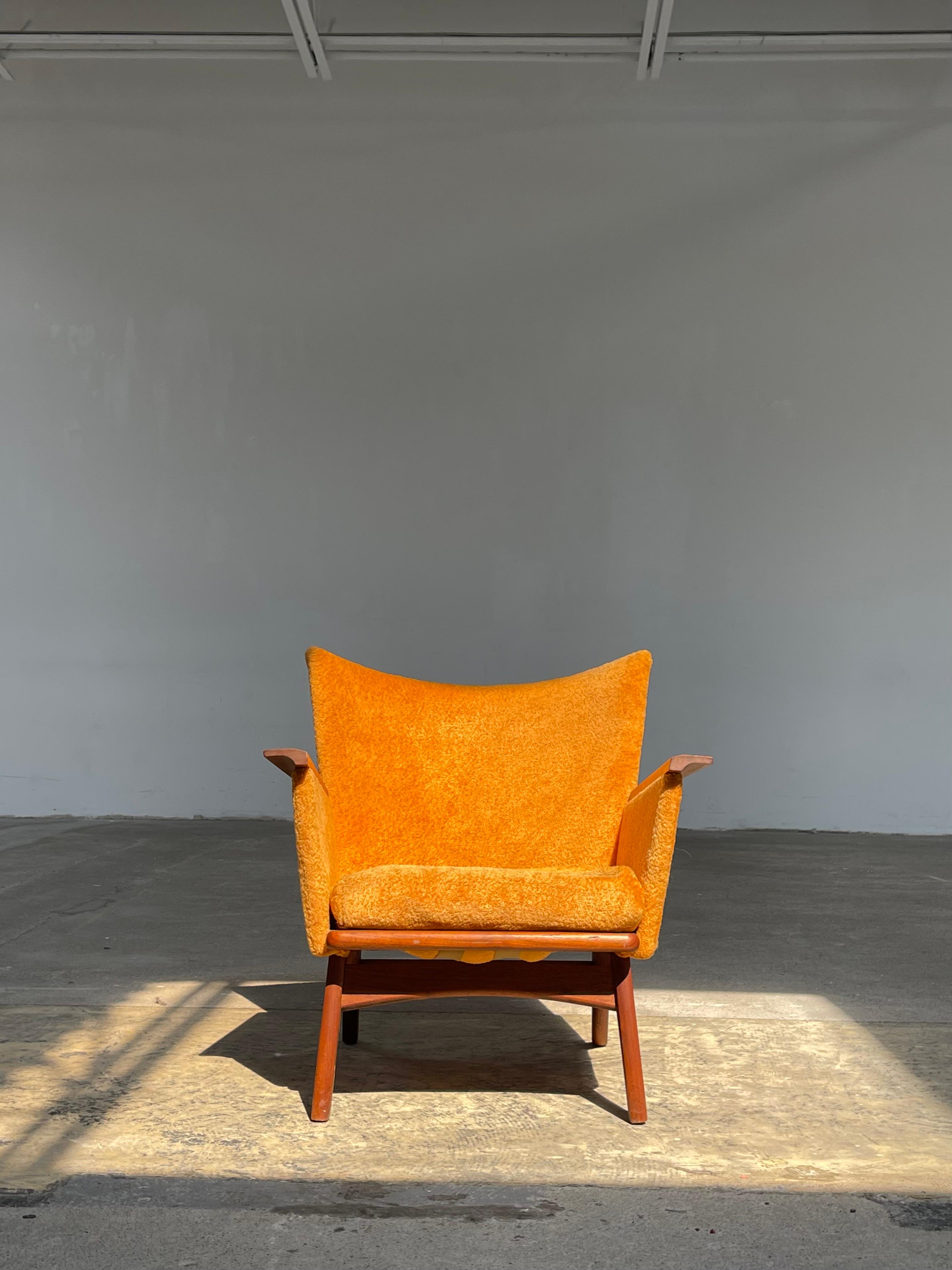 A bold example of mid-century modern design, this authentic, vintage Adrian Pearsall lounger is beautiful to behold. 

Beautiful solid walnut base & arm details. Sharp, angular construction, with high pile shearling-style orange upholstery.

Seat