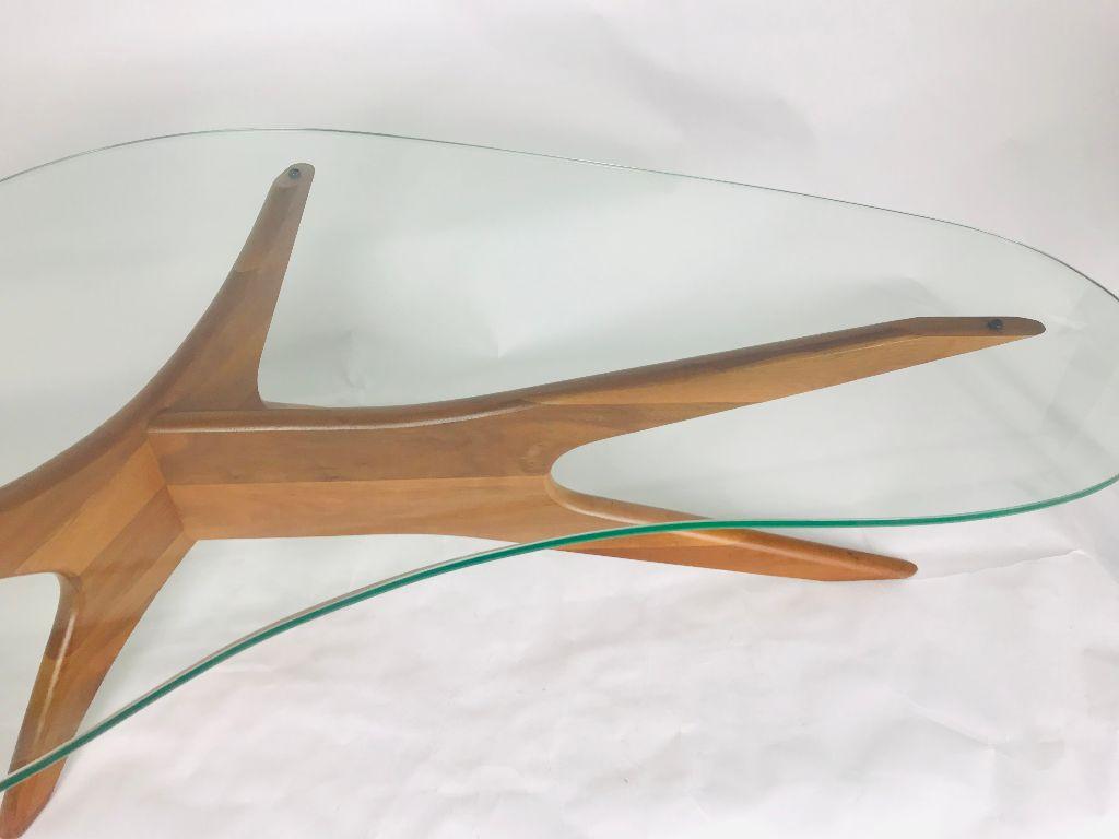 Iconic Adrian Pearsall Biomorphic coffee table in beautiful original condition. Length is 50 inches, width 31 inches and height is 15 3/4 inches. Boomerang shaped glass top is without chips or cracks. Very fine scratches only.
Walnut base is in