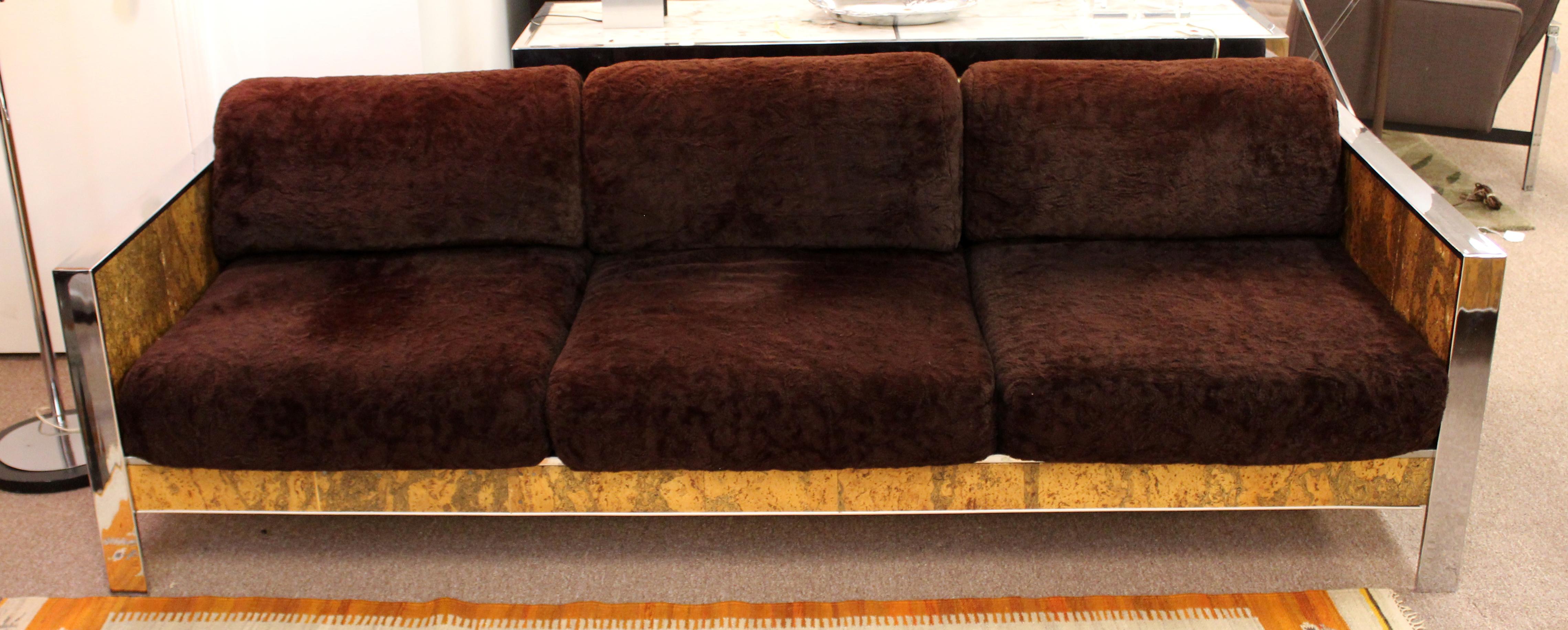 For your consideration is an incredible sofa, made of cork and trimmed in flat bar chrome, by Adrian Pearsall, circa the 1970s. In very good vintage condition. The dimensions are 84.5