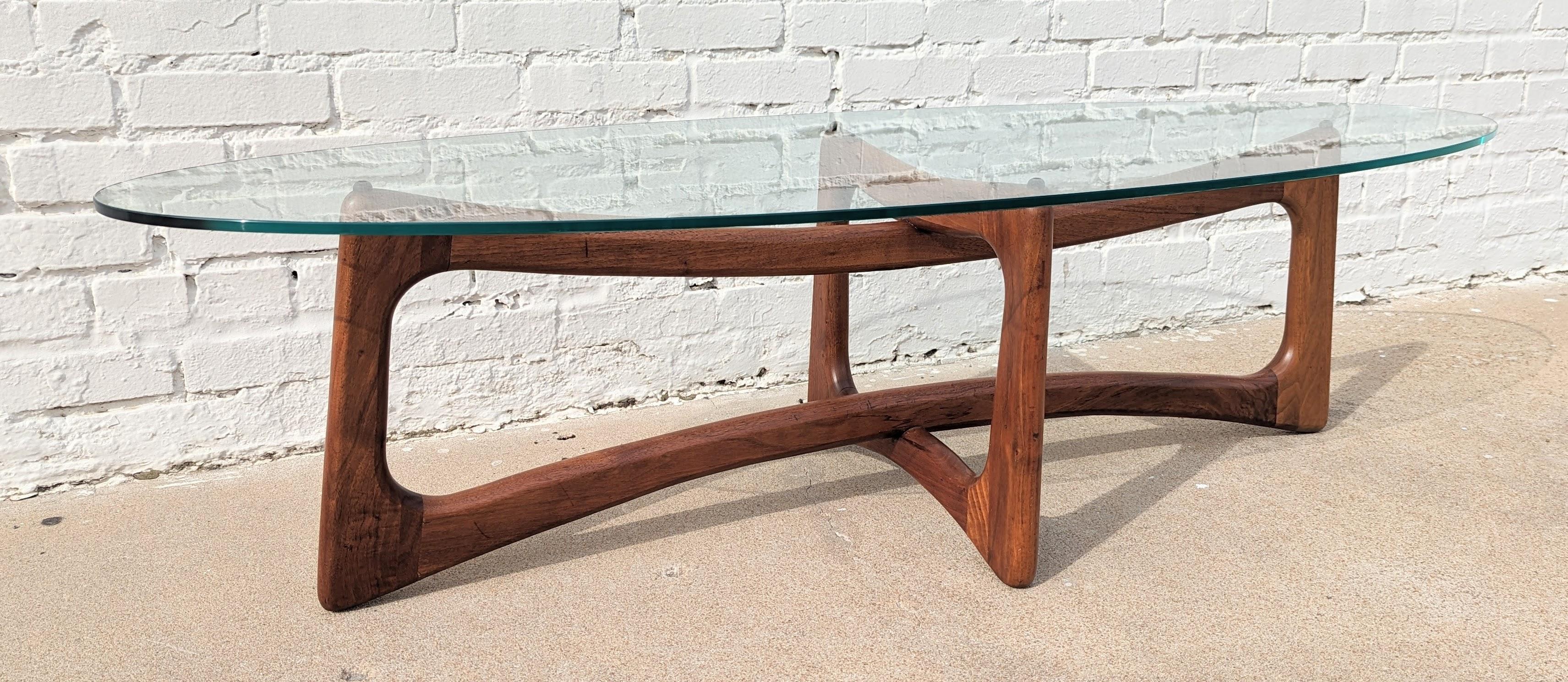 Adrian Pearsall Stingray Coffee Table.  Beautiful and well constructed. Solid Walnut frame and thick 3/8-in glass top. Above average condition and structurally sound. Iconic modern design.  Please ask any additional questions through message.
Scott
