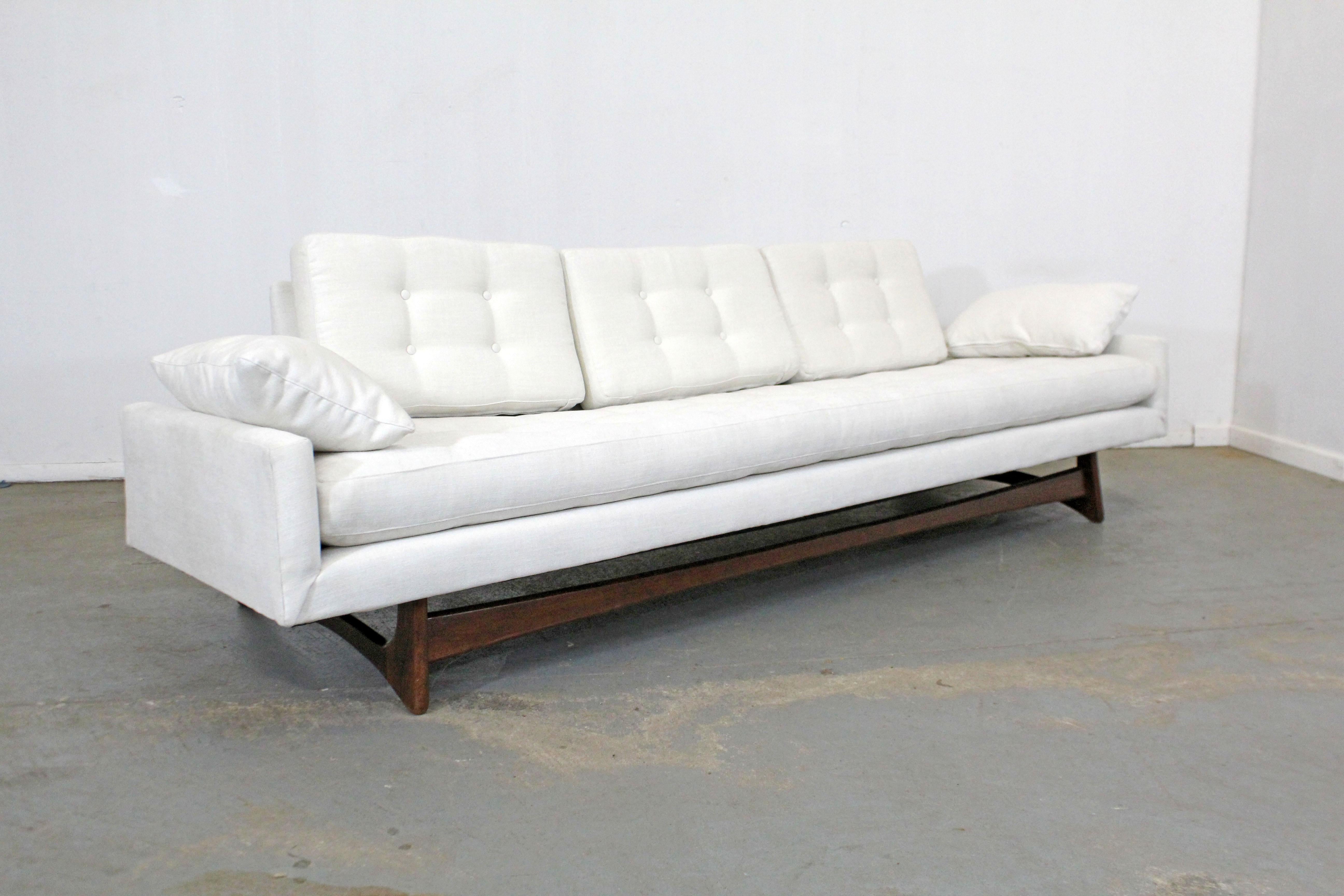 What a find. Offered is a beautifully restored 'Gondola' sofa (model 2408) designed by Adrian Pearsall for Craft Associates. Features refinished sculpted wood legs and has been reupholstered with textured designer fabric in 'Pontiac Coconut' by