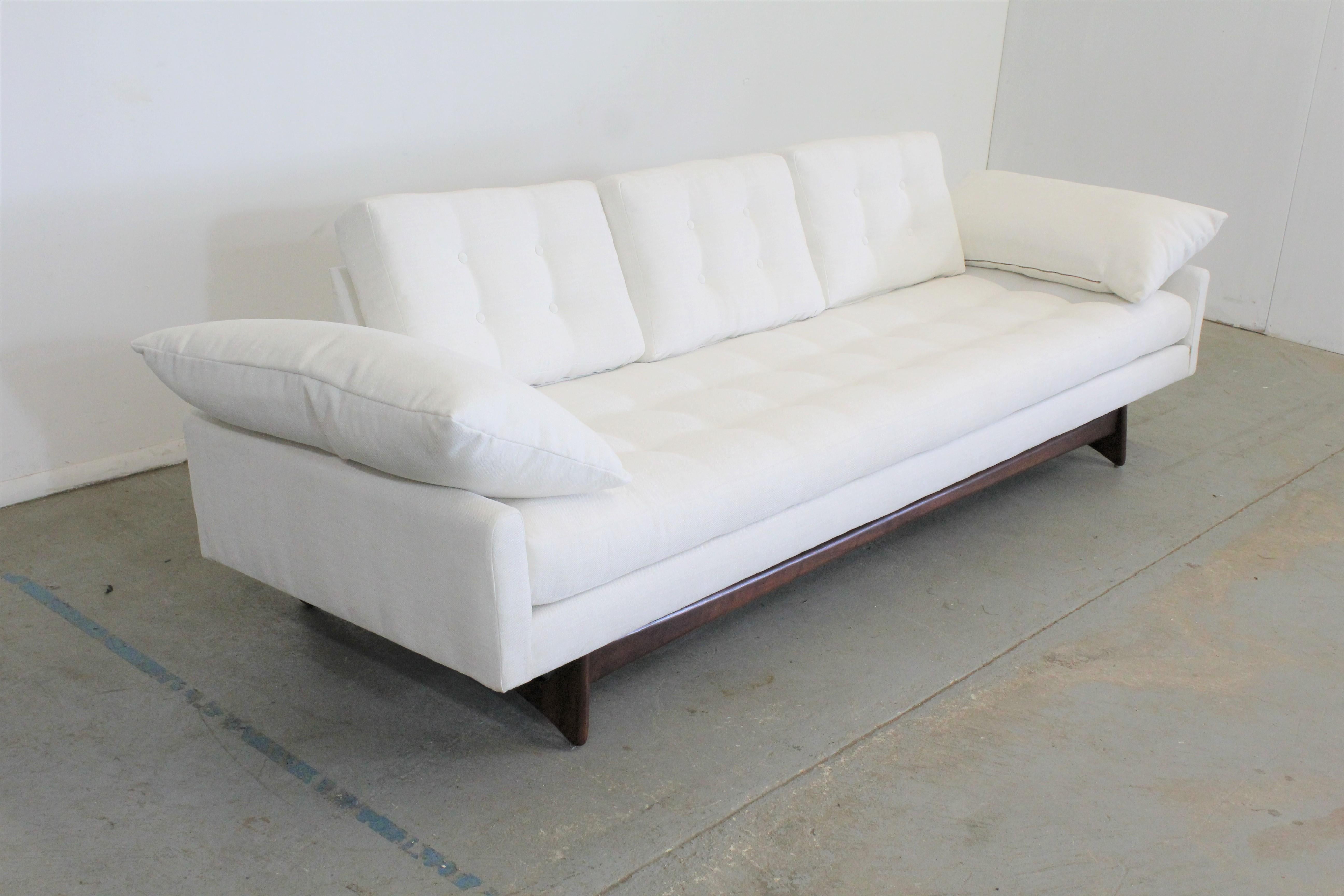 Offered is a beautifully restored 'Gondola' sofa (model 2408) designed by Adrian Pearsall for Craft Associates. Features refinished sculpted wood legs and has been reupholstered with textured designer fabric in 'Pontiac Coconut' by Norbar. In