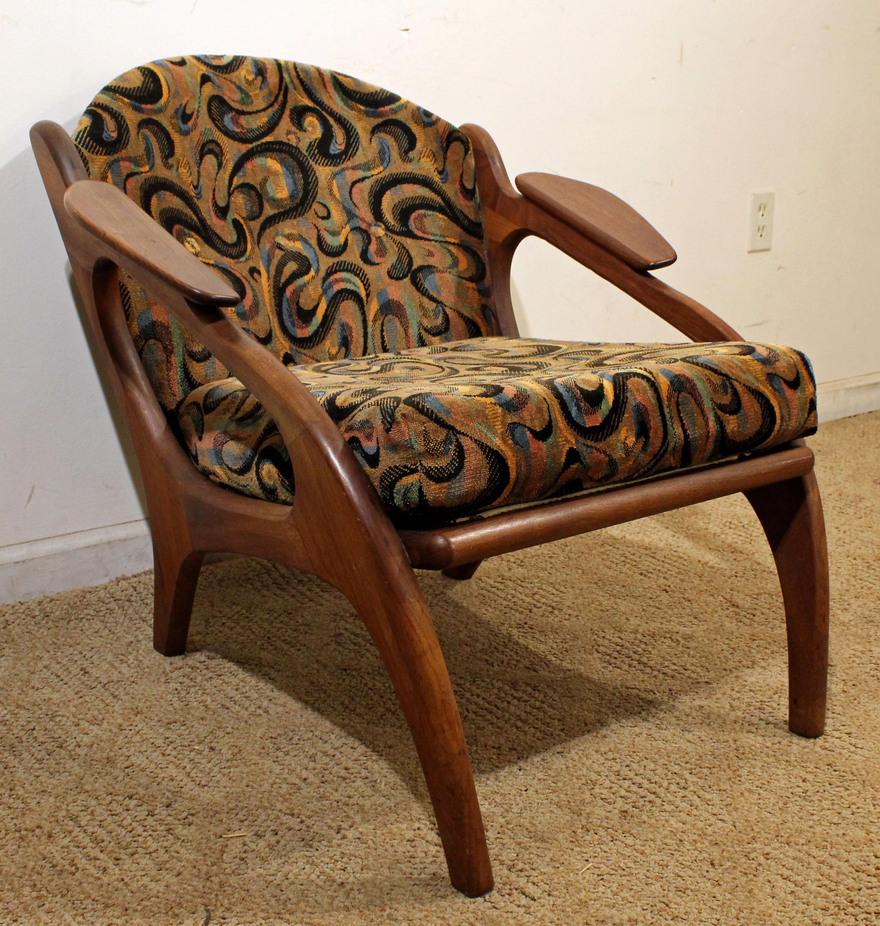 What a find. Offered is an Adrian Pearsall for Craft Associates walnut lounge chair #2249-C. Features a walnut base with uniquely sculpted arm rests and upholstery. It is in great condition, showing some age wear. It is not
