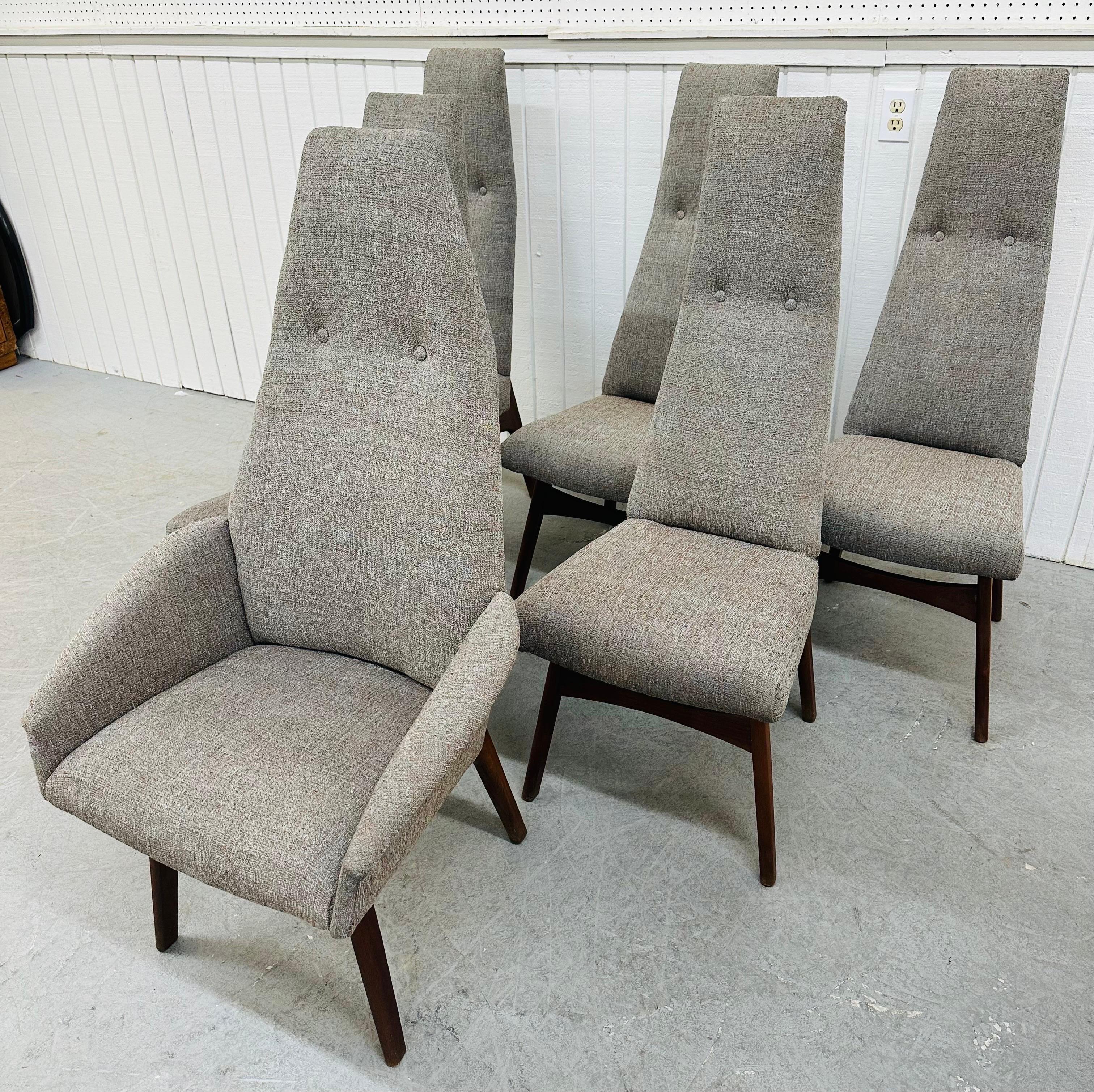 This listing is for a set of six Mid-Century Modern Adrian Pearsall High-Back Dining Chairs. Featuring one arm chair, five straight chairs, newly upholstered gray fabric, and walnut legs. This is an exceptional combination of quality and design by