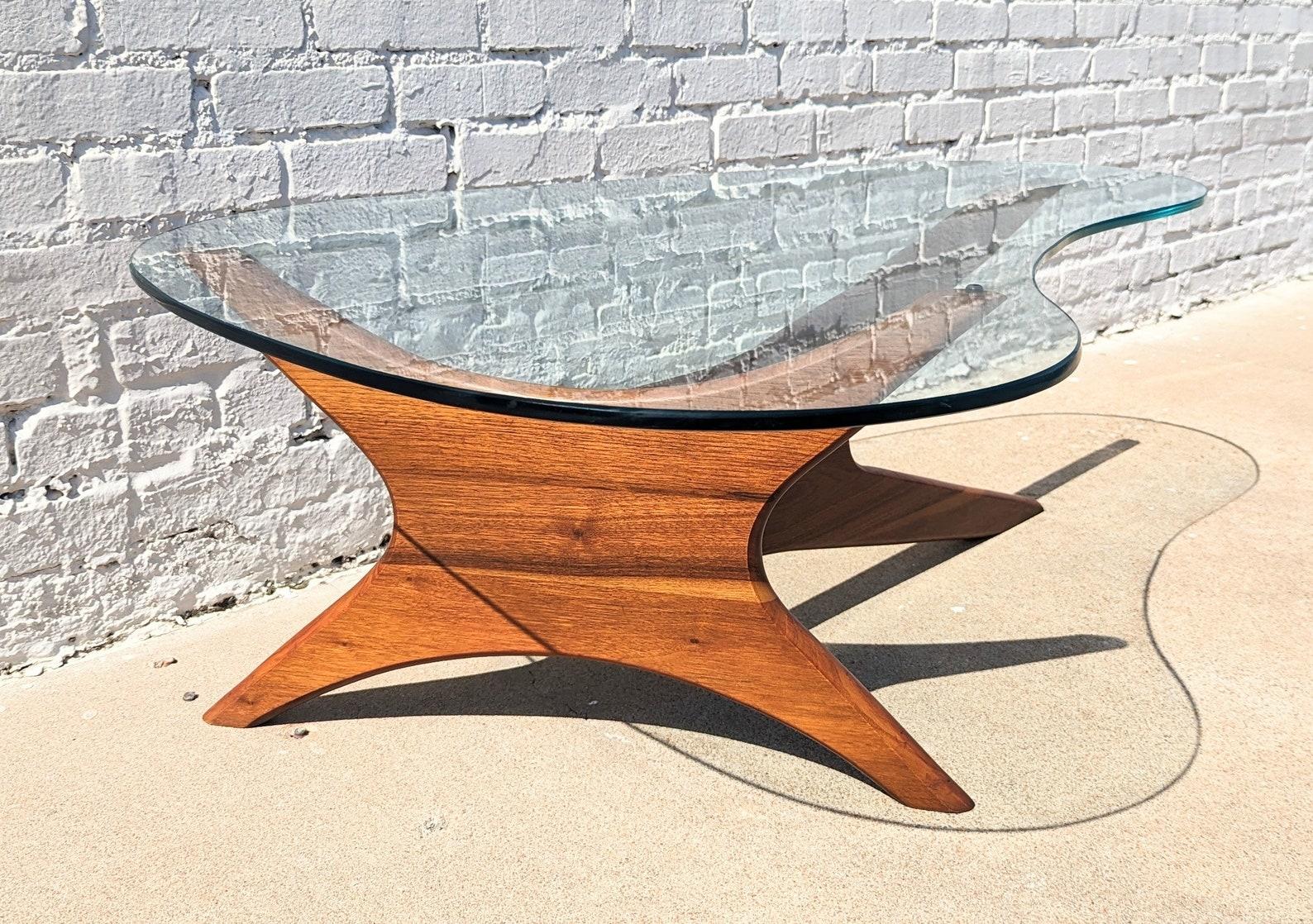 Mid Century Modern Adrian Pearsall Jacks Coffee Table

Above average vintage condition and structurally sound. Has some expected slight finish wear and scratching on frame. Glass has some surface scratching and a couple deeper scratches but no chips