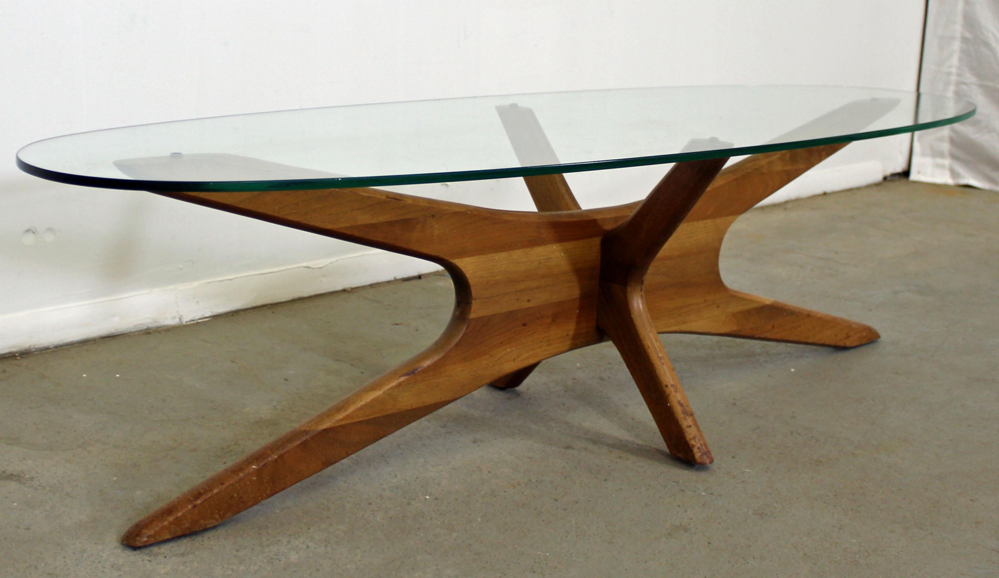 Offered is an authentic Adrian Pearsall 'Jacks' coffee table with a sculpted wooden base and thick glass top. In good condition for its age, minor surface wear. It is not signed. A great piece to add to any room! See our other listings for a