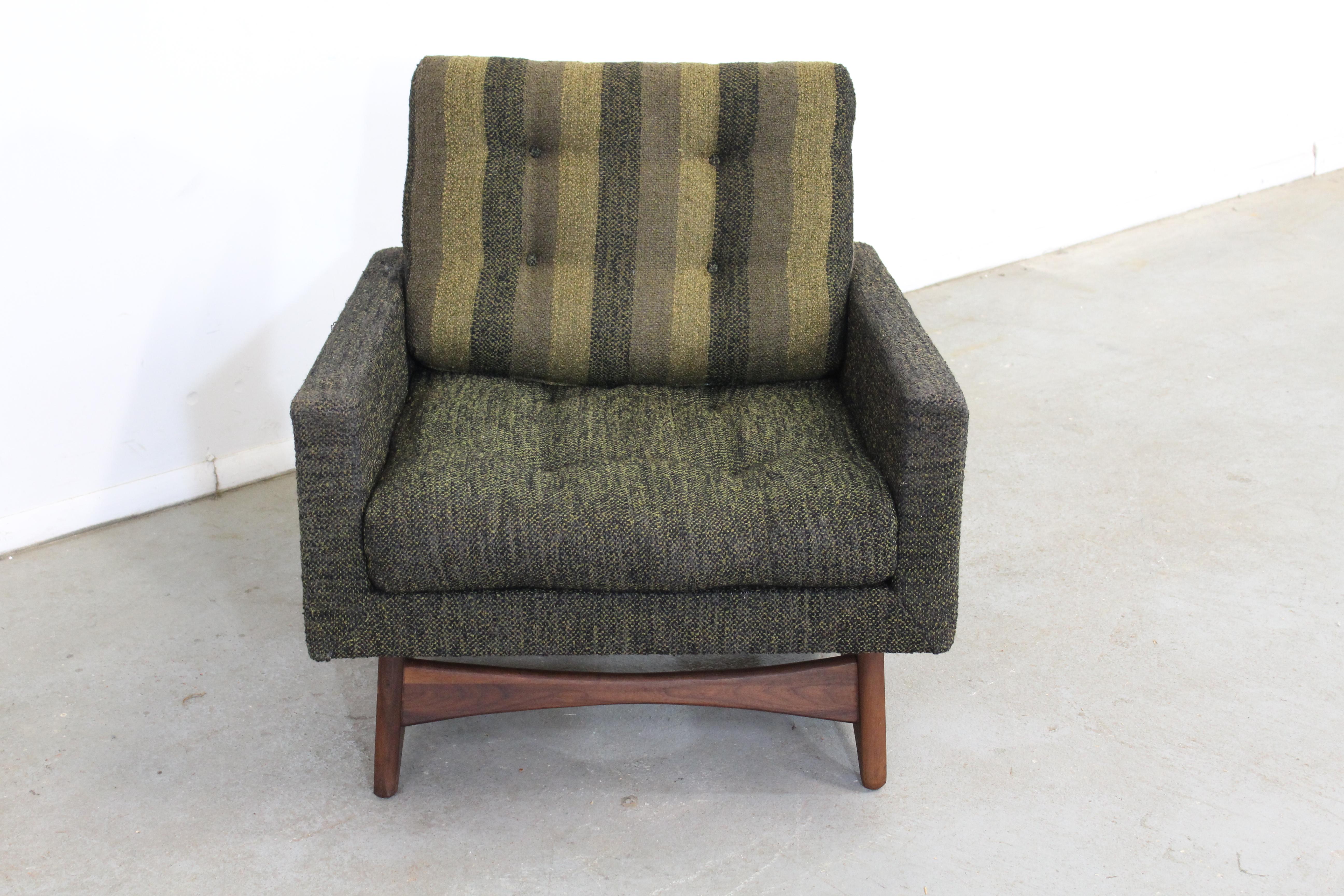 Offered is a vintage sculptural lounge chair, designed by Adrian Pearsall for Craft Associates (#2406-C). Features a walnut base with uniquely sculpted base and upholstery. It is in good, structurally sound condition, showing some age wear with some