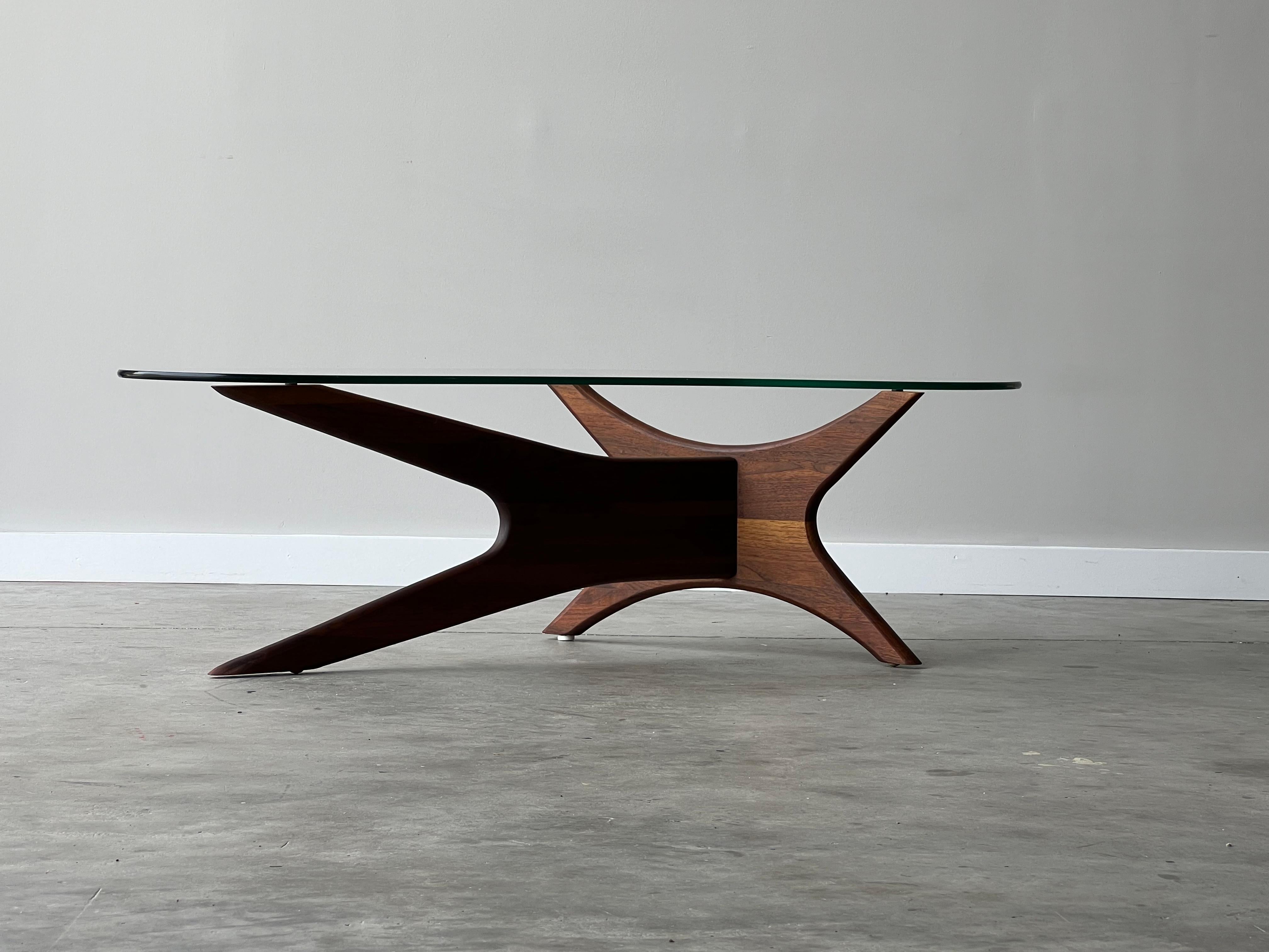 Mid-century Adrian Pearsall kidney shaped sculptural coffee table. Beautiful craftsmanship and glass shape. Base of the table is made from sculpted walnut and the glass top works cohesively with the base. Can transform your interior with beautiful