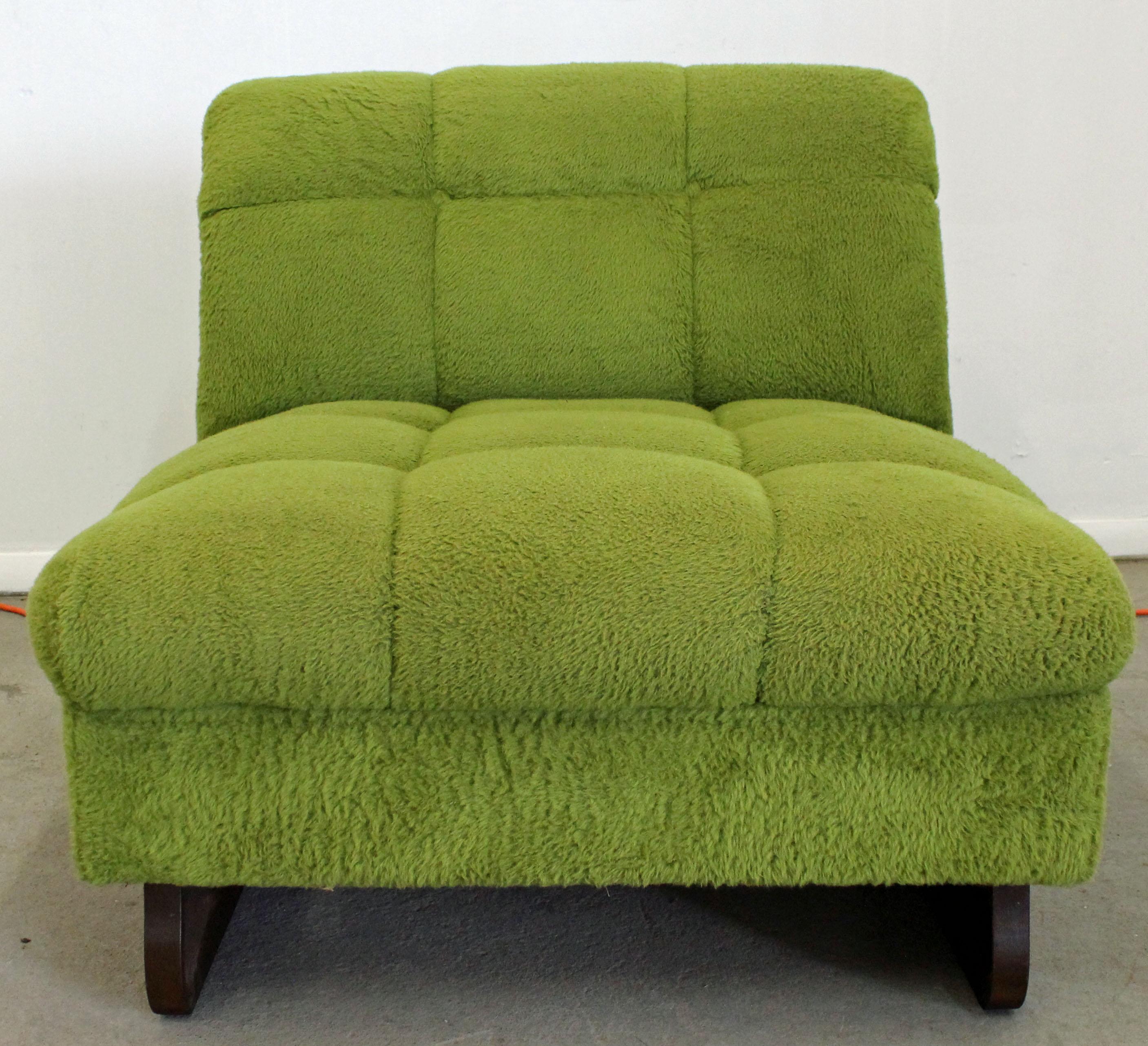 Offered is a Mid-Century Modern slipper chair in the style of Adrian Pearsall. The chair features green upholstery and sculpted walnut legs. It is in good condition, showing some age wear, needs to be reupholstered. The chair makes an excellent