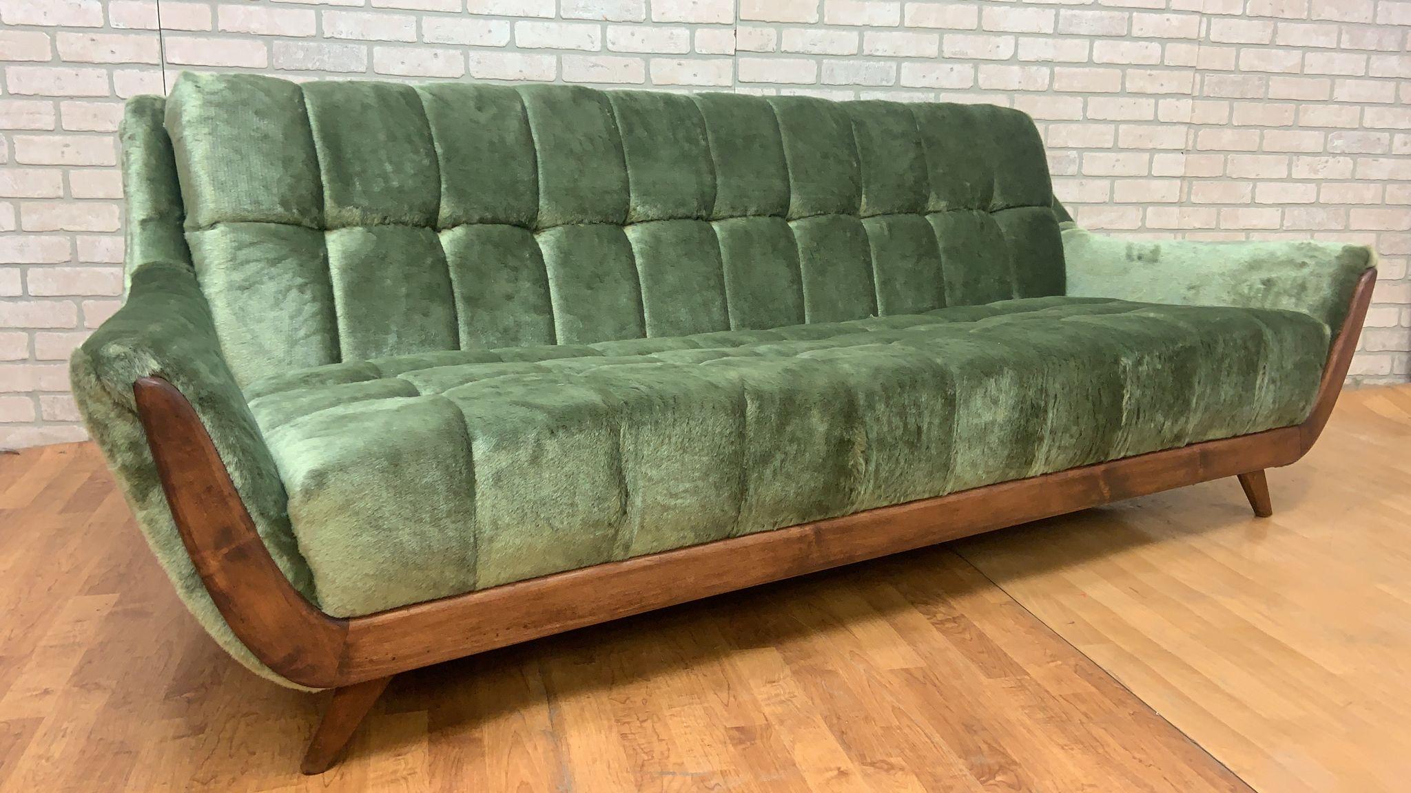 Mid Century Modern Adrian Pearsall Style Walnut Framed Gondola Sofa Newly Upholstered in Plush Emerald Box Tufted Shag Fabric

This mid century modern Adrian Pearsall walnut framed tufted Gondola sofa is a stylish and classic piece that will elevate