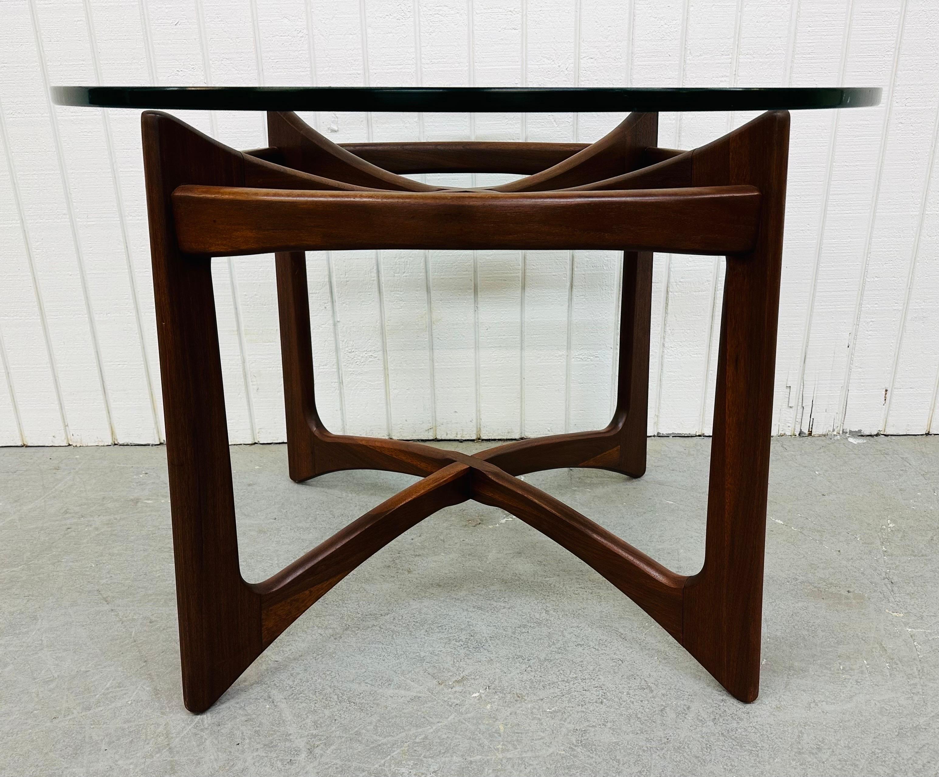 This listing is for a Mid-Century Modern Adrian Pearsall Walnut Compass Dining Table. Featuring a thick round glass top and a walnut compass style base. This is an exceptional combination of quality and design by Adrian Pearsall.