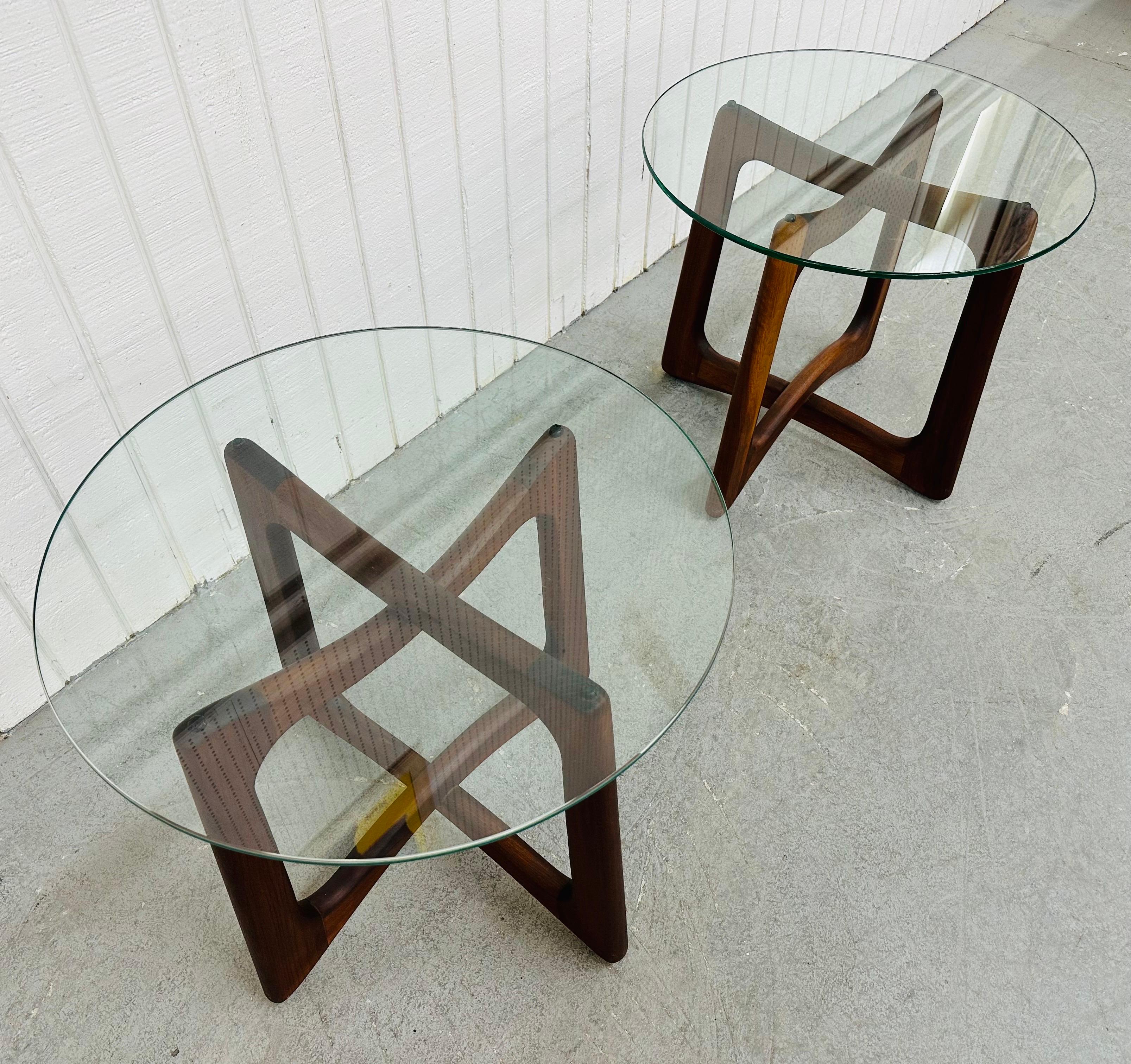 This listing is for a pair of Mid-Century Modern Adrian Pearsall Walnut Glass Top Side Tables. Featuring round glass tops and crisscross walnut bases. This is an exceptional combination of quality and design by Adrian Pearsall!