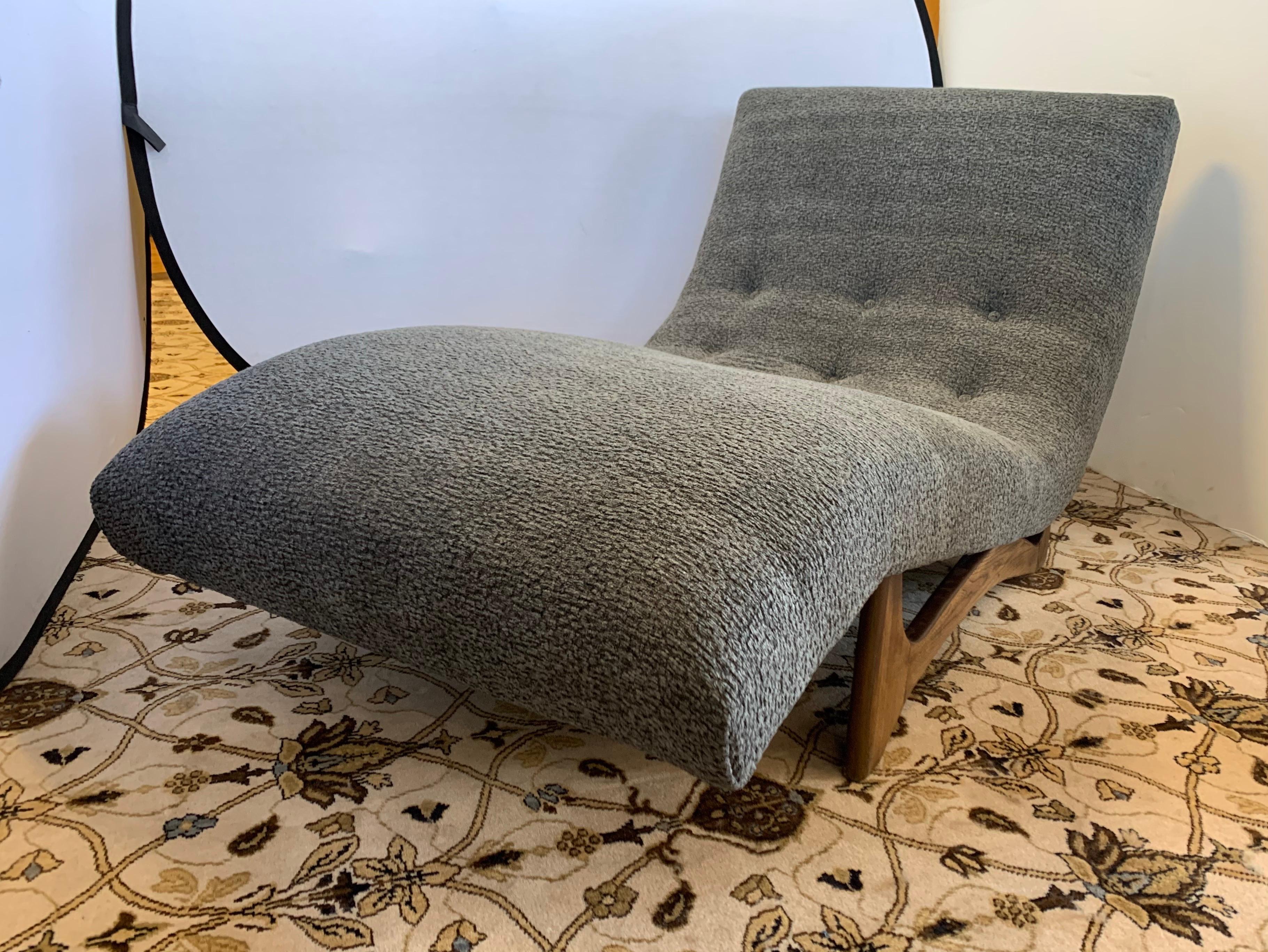 A magnificent Adrian Pearsall Wave chaise longue sofa that has been newly reupholstered in a Donghia Boucle fabric with a one of a kind color of gray and silver weave. Iconic Adrian Pearsall seating is some of the most sought after pieces in the mid