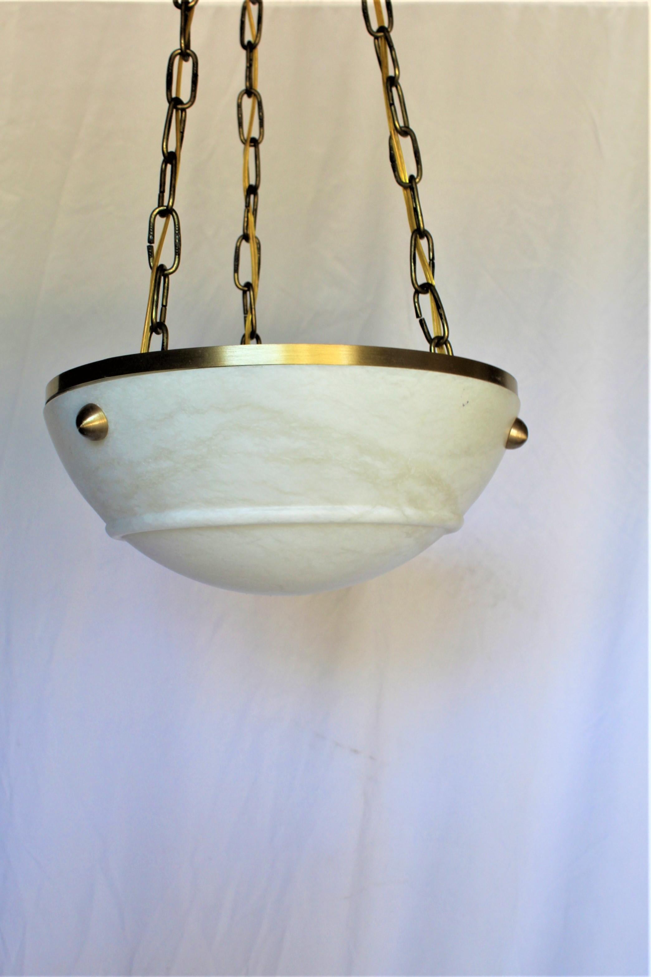 A good design of a smaller Chandelier perfect for an entry way or bathroom .  Has solid brass banding at top of the Alabaster and half circle solid brass attachments . Ceiling cap is at 5