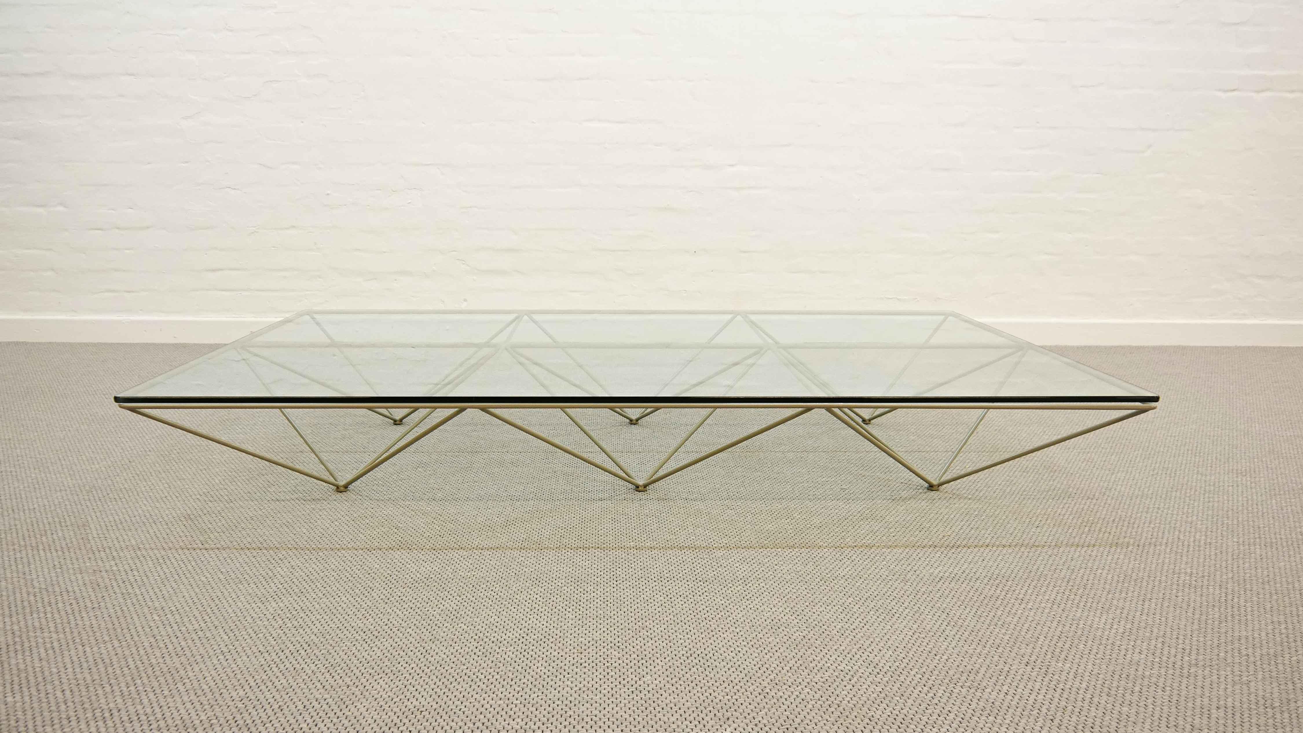 Mid-century coffee table / sofa table Alanda by Paolo Piva 1982 for B&B Italia in large Version. The design of the table is architectural and constructivistic, but minimalistic in its appearance. The glass tabletop with rounded edges sits upon a