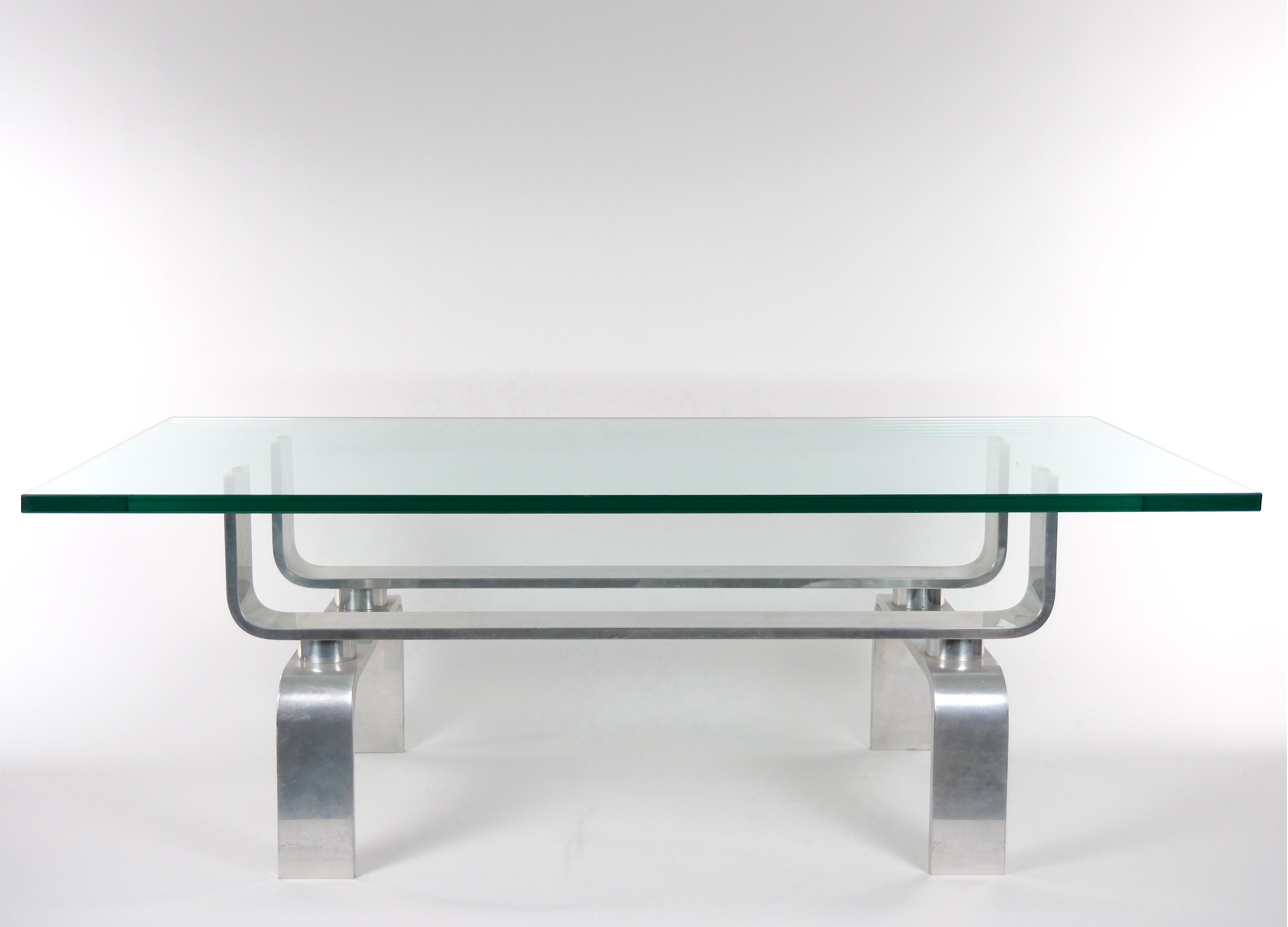 
Experience the timeless allure of Mid-Century Modern design with this captivating coffee table. featuring an aluminum frame base and a heavy glass top, this table effortlessly combines sleek sophistication with sturdy functionality. The table's