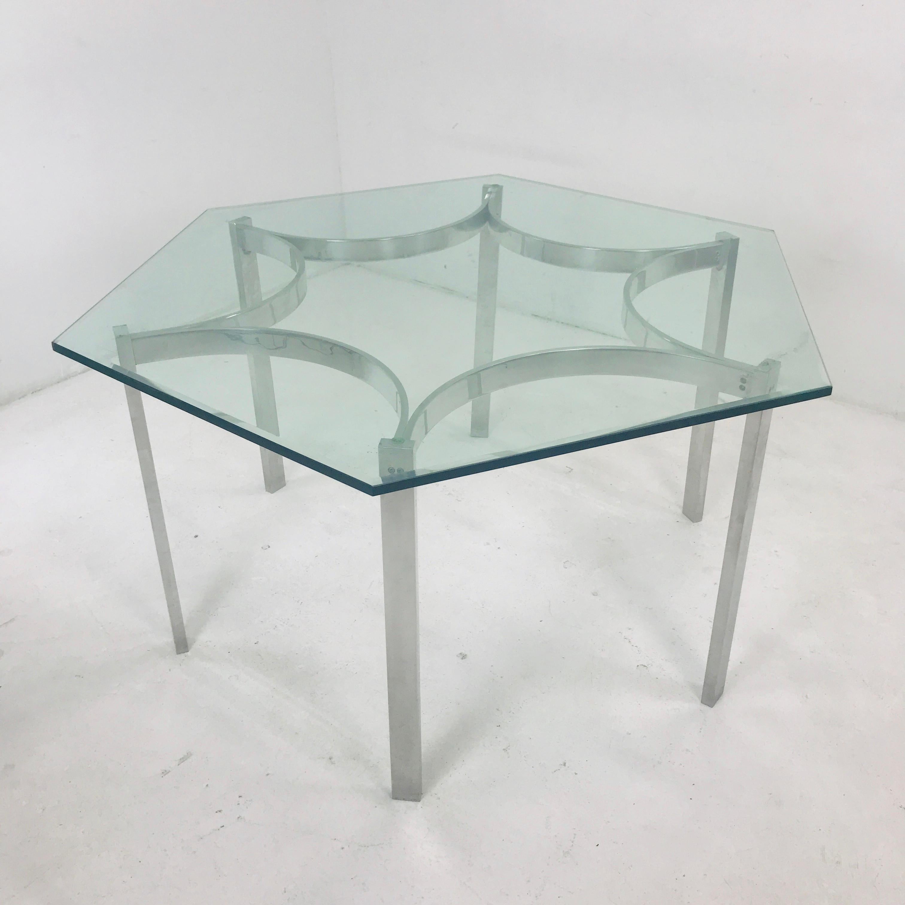 Mid-Century Modern aluminum dining table with glass top. Glass can be changed to allow for more chairs.