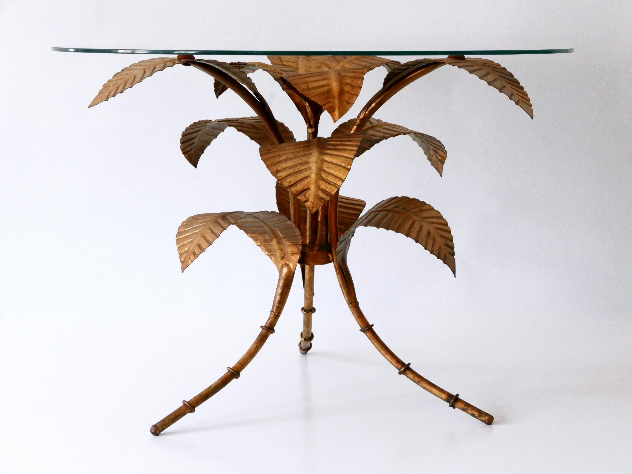 Highly decorative and rare coffee table with gilt metal palm leaves.
Designed and manufactured by Hans Kögl, Germany, 1970s.

PS: The coffee table will be sold without glass top. Otherwise it would be more expensive to ship it than to buy a new