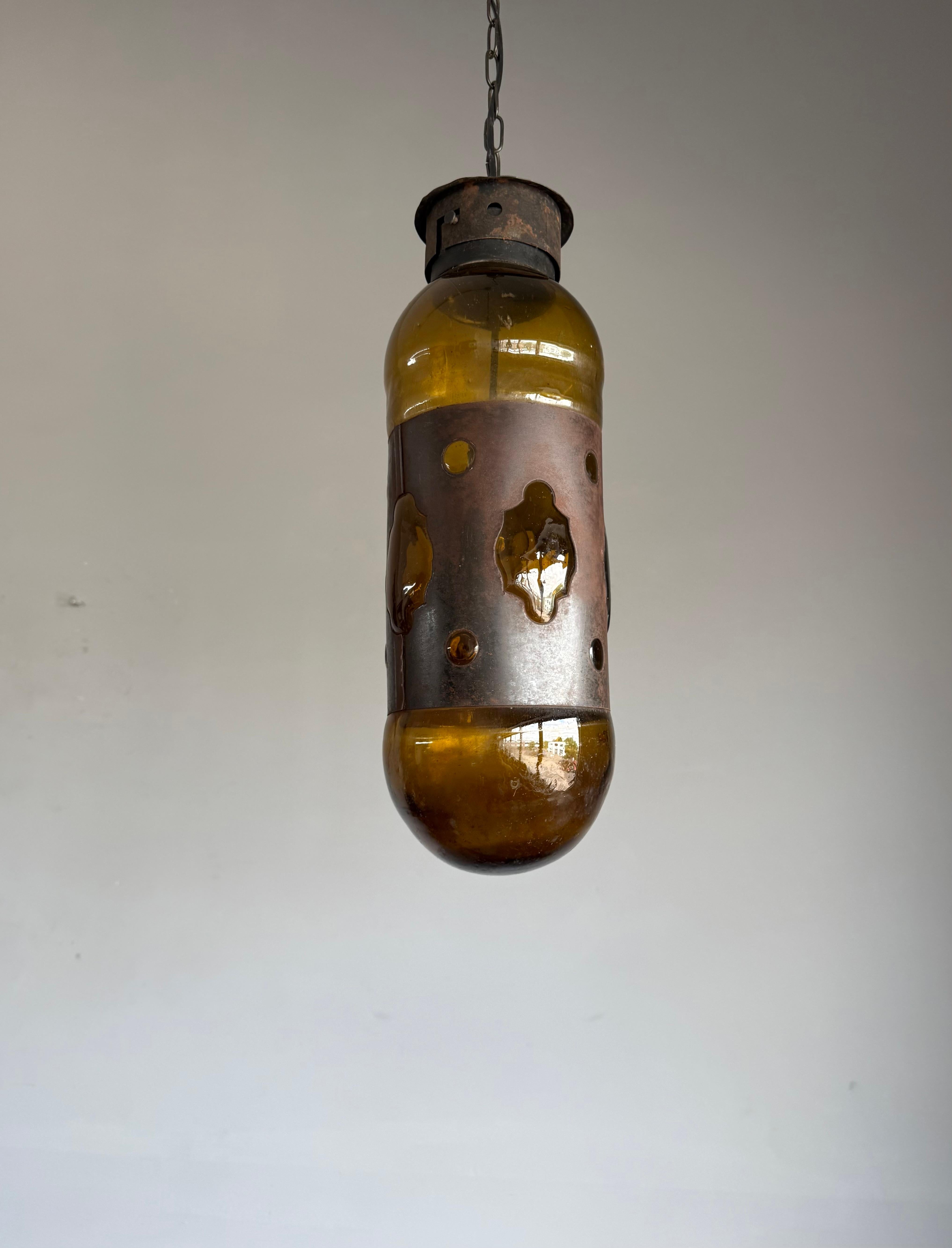 Dutch Mid-Century Modern Amber Glass and Patinated Metal Pendant, Attr. to Nanny Still For Sale