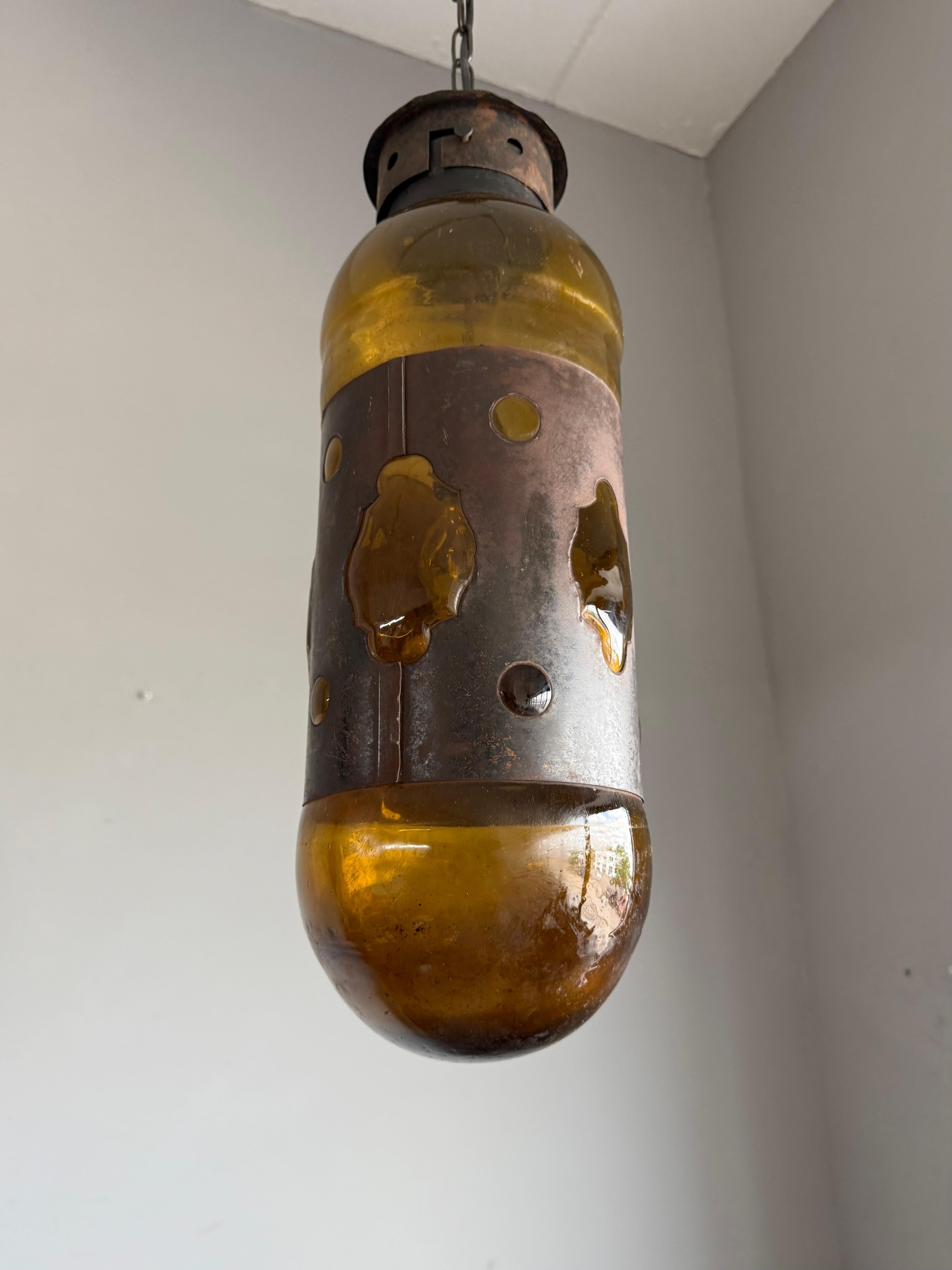 Forged Mid-Century Modern Amber Glass and Patinated Metal Pendant, Attr. to Nanny Still For Sale