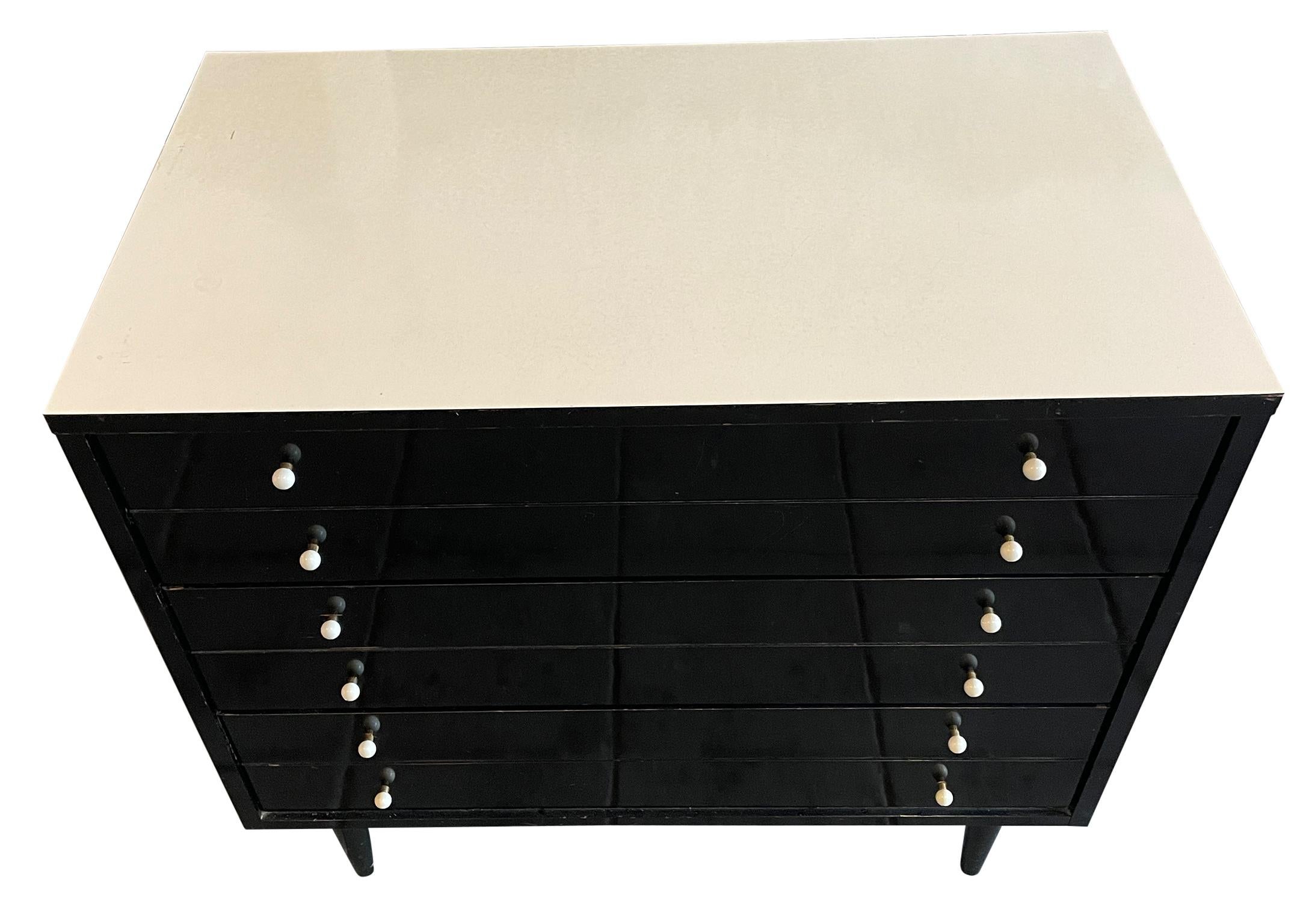 Mid-Century Modern American of Martinsville 3 drawer dresser black white. All original vintage condition - black lacquer shows wear - white glass and brass knobs. All drawers slide smooth and clean inside. Has white laminate top. Located in Brooklyn