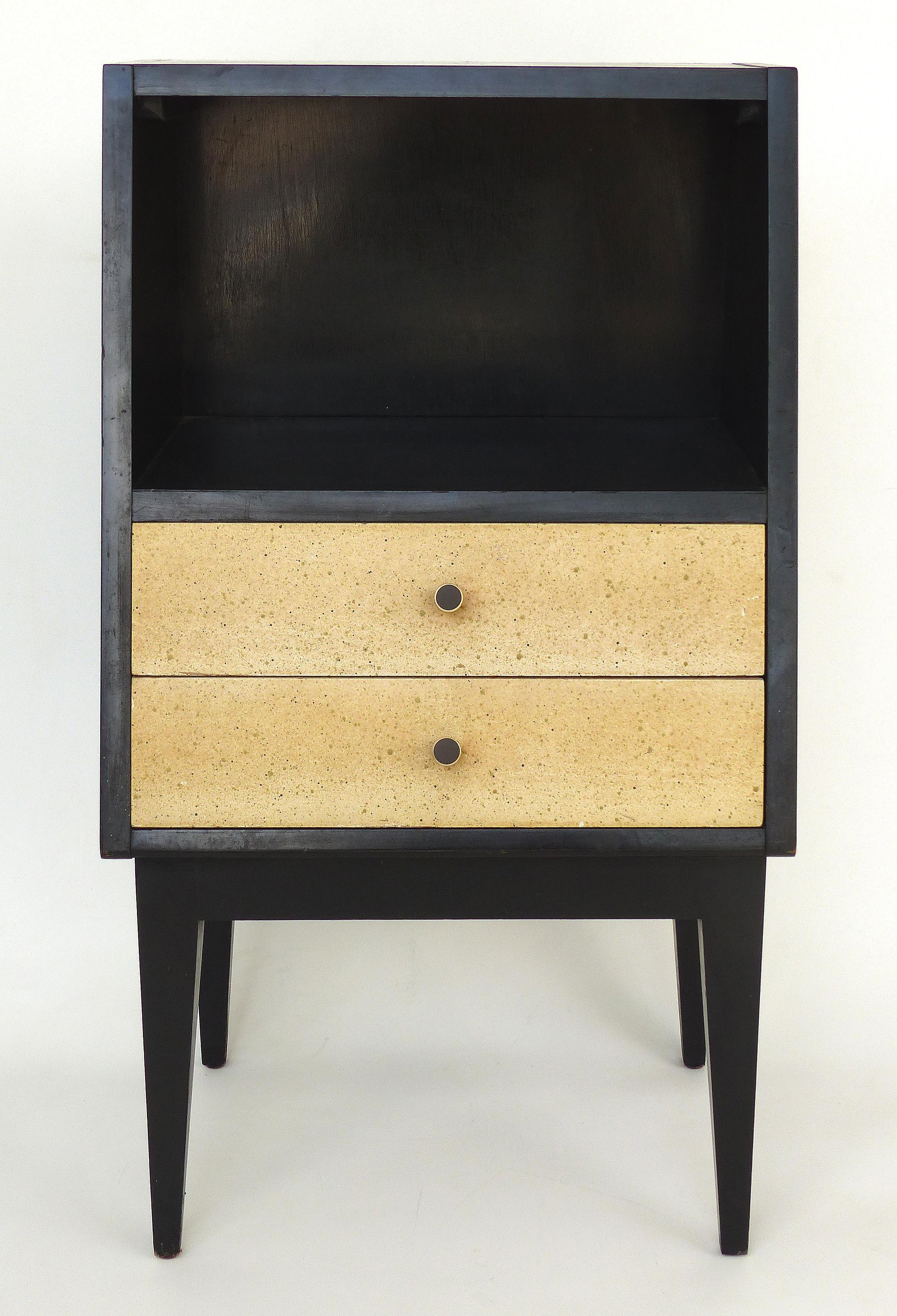  American of Martinsville Mid-century Modern Telephone Stand with two drawers

Offered for sale is a sleek mid-century modern American of Martinsville telephone table with an ebonized finish, two drawers with a speckled finish, brass hardware and an