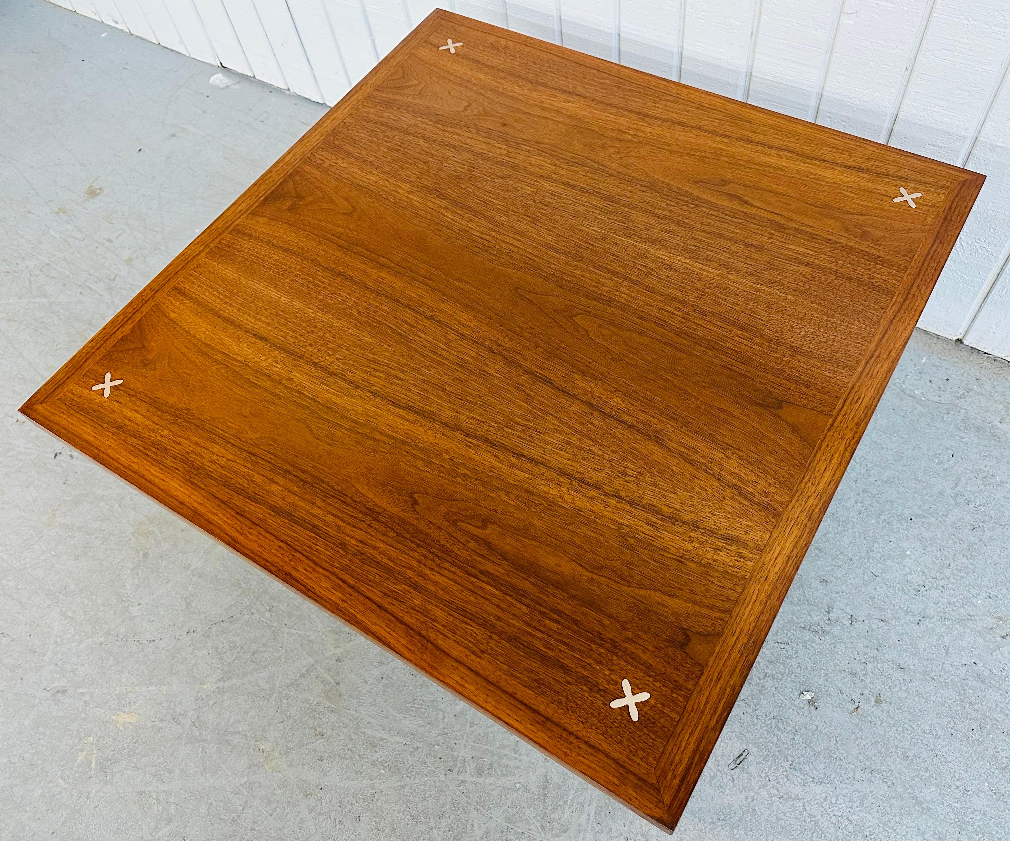 This listing is for a Mid-Century Modern American of Martinsville Walnut Coffee Table. Featuring a square top, inlaid crosses at each corner, modern screw on legs, and a beautiful walnut finish. This is an exceptional combination of quality and