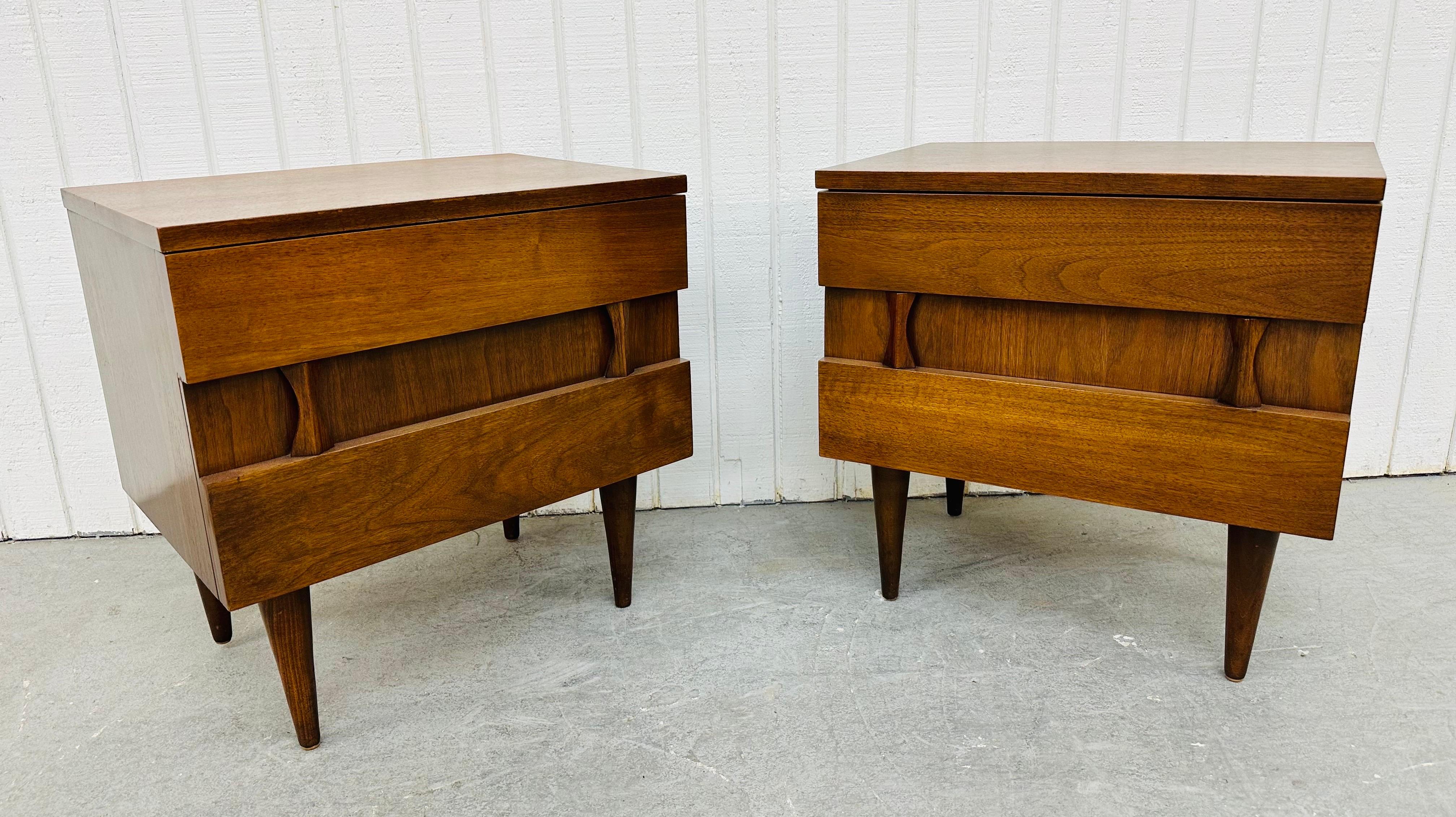 This listing is for a pair of Mid-Century Modern American of Martinsville Walnut Nightstands. Featuring a straight line design, brutalist front design, two drawers for storage, modern legs, and a beautiful walnut finish. This is an exceptional