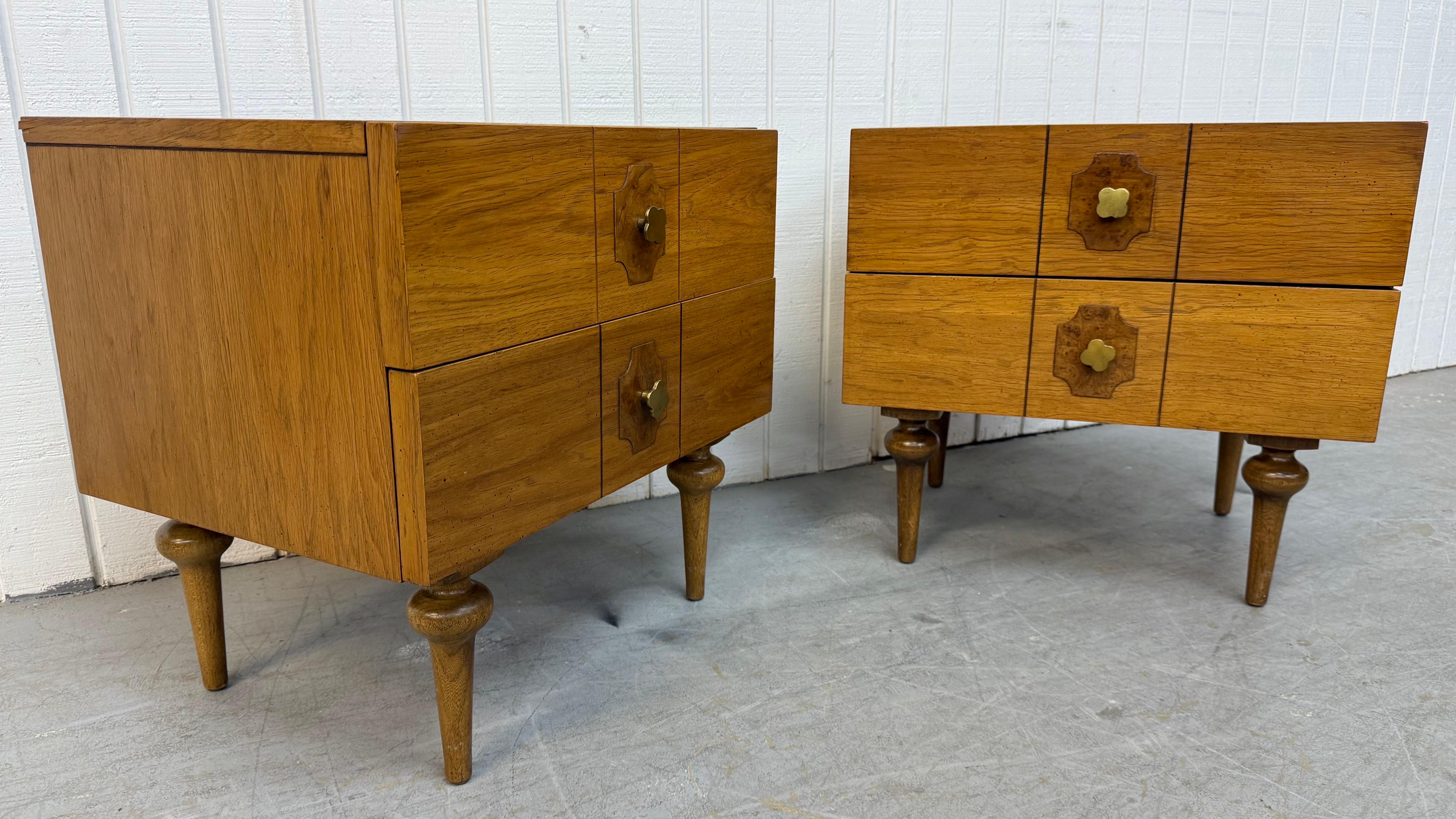 This listing is for a pair of Mid-Century Modern American of Martinsville Walnut Nightstands. Featuring a straight line design, two drawers for storage, burled wood accent with brass hardware, modern legs, and a beautiful walnut finish. This is an