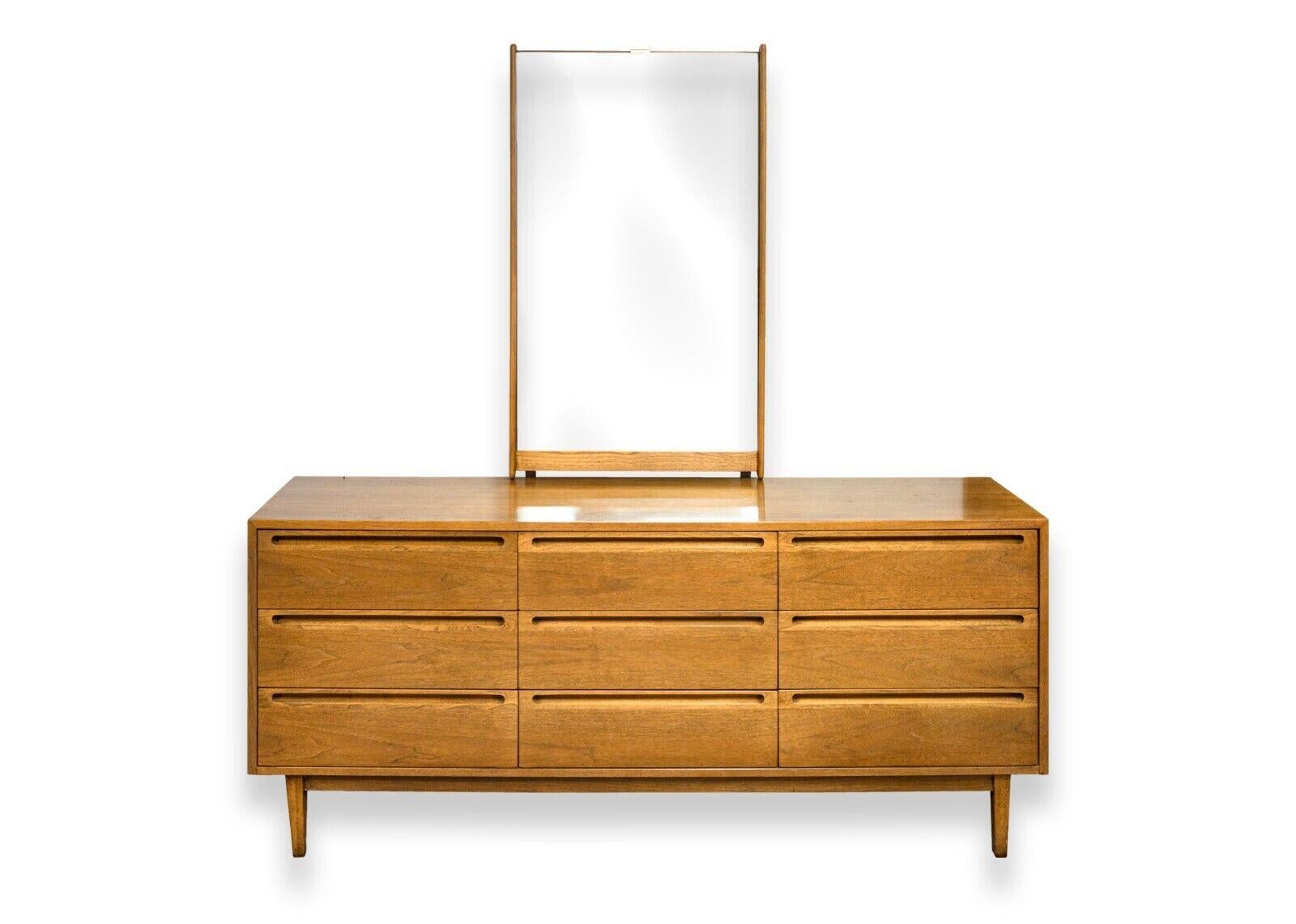 A mid century modern American of Martinsville 6pc bedroom set. This is a truly wonderful set of mid century bedroom furniture. The set includes a dresser with an attached vanity mirror, a tall boy dresser, a queen size headboard, and 2 matching side
